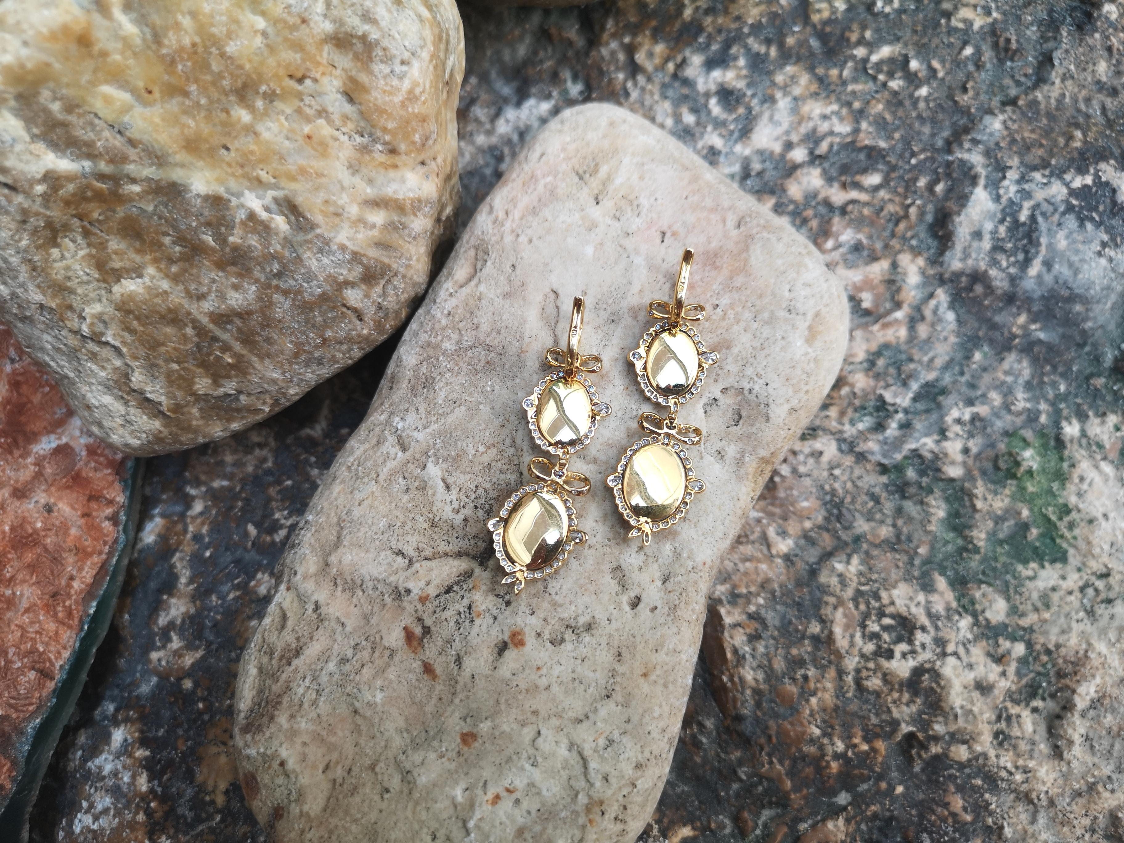 Women's Diamond Earrings Set in 18 Karat Gold Settings For Sale