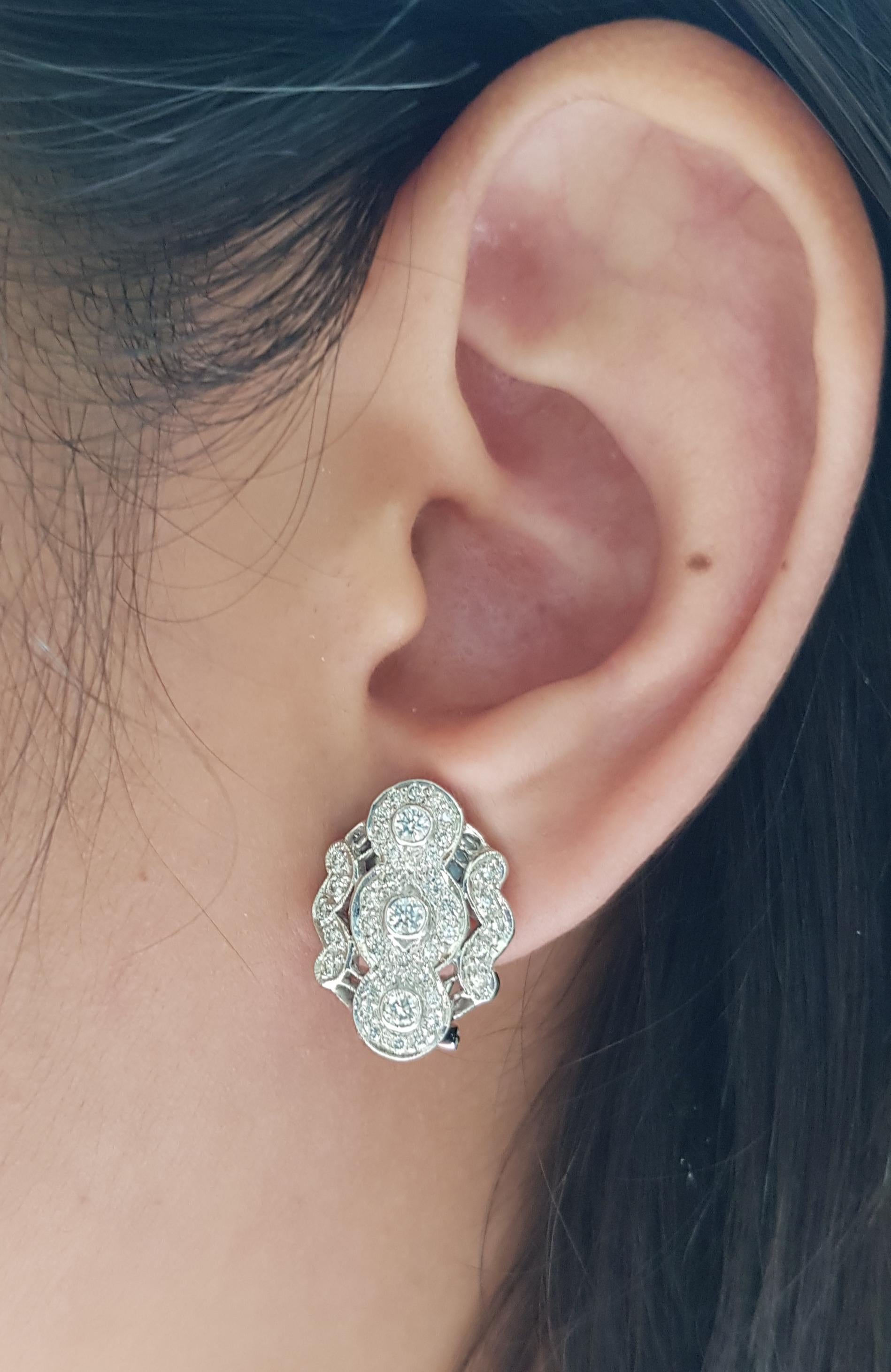 Diamond 1.14 carats Earrings set in 18 Karat White Gold Settings

Width:  1.5 cm 
Length: 1.9 cm
Total Weight: 10.71 grams

