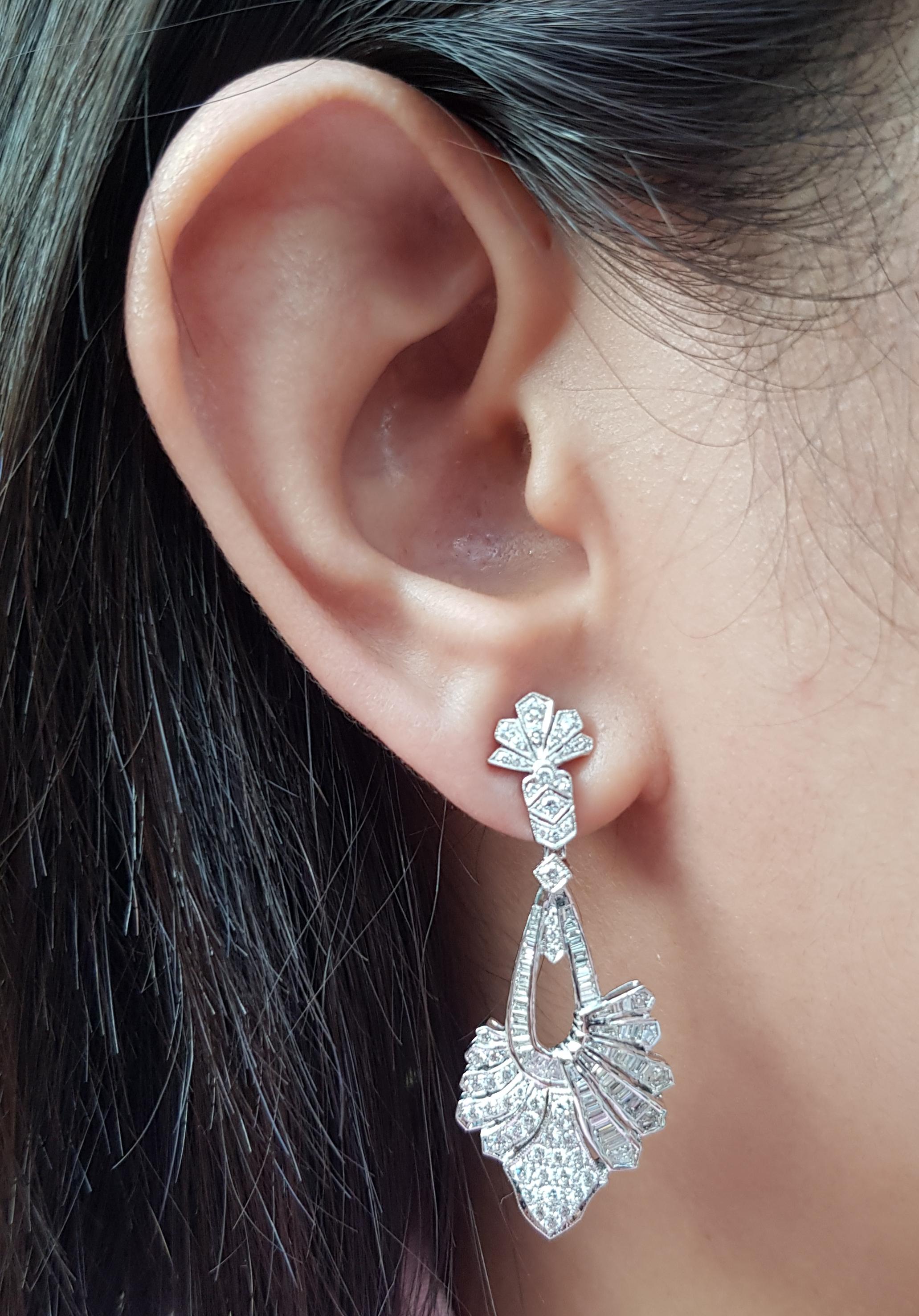 Diamond 2.45 carats Earrings set in 18 Karat White Gold Settings

Width:  1.8 cm 
Length: 4.5 cm
Total Weight: 12.71 grams

