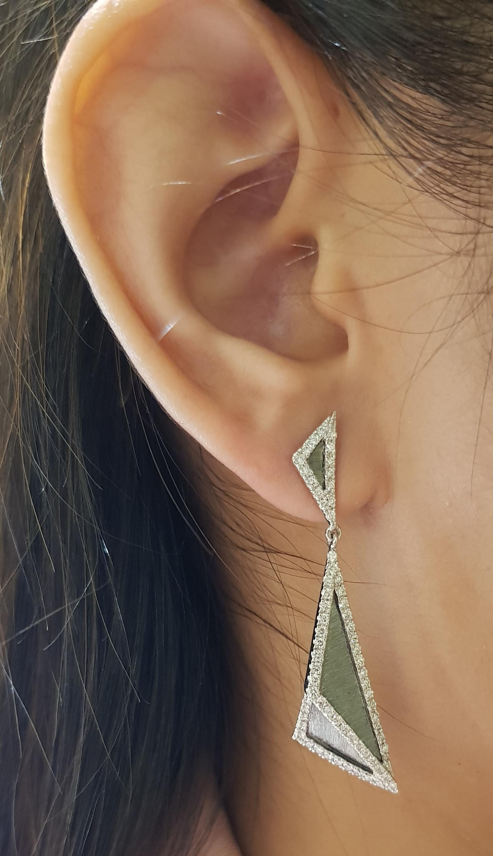 Diamond 1.17 carats Earrings set in 18 Karat White Gold Settings

Width:  1.2 cm 
Length:  4.7 cm
Total Weight: 9.74 grams

The ancient Japanese tradition of paper folding has inspired the form and elements of this modern collection. With a series