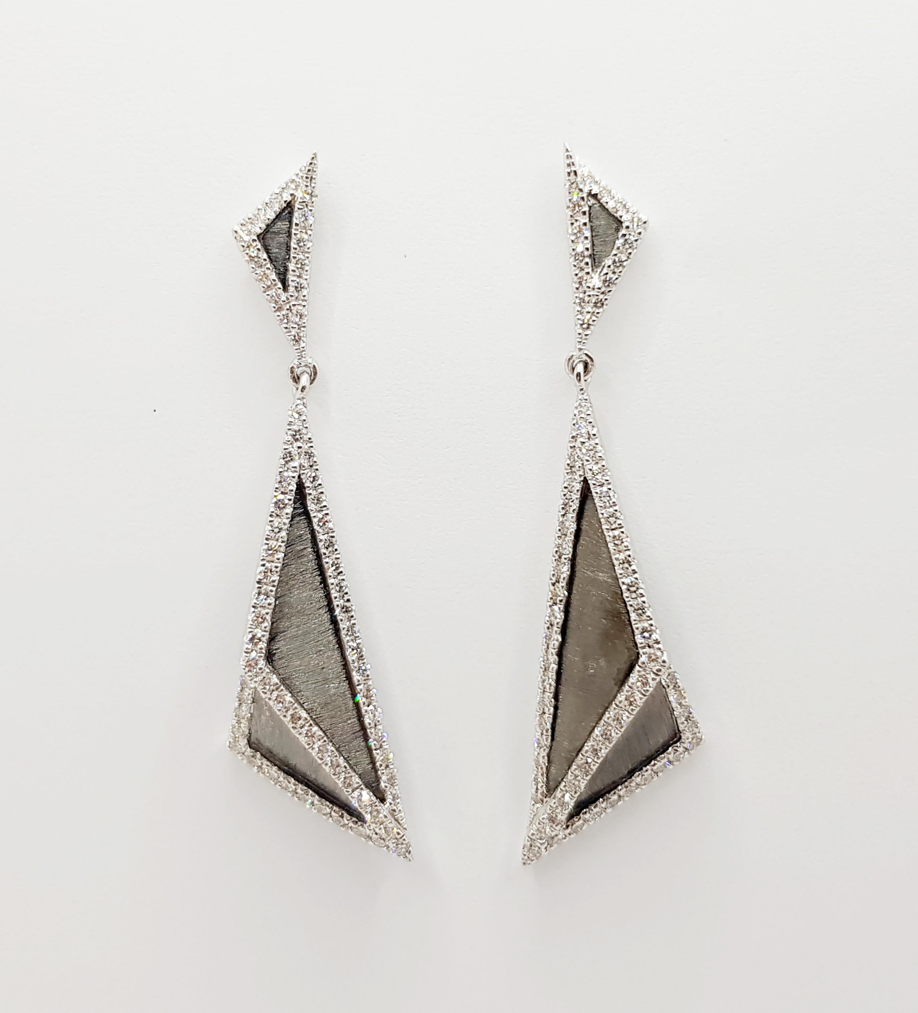 Contemporary Diamond Earrings Set in 18 Karat White Gold Settings For Sale