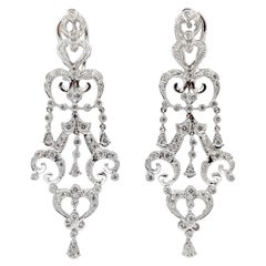 Boucles d'oreilles en or blanc 18 carats serties de diamants