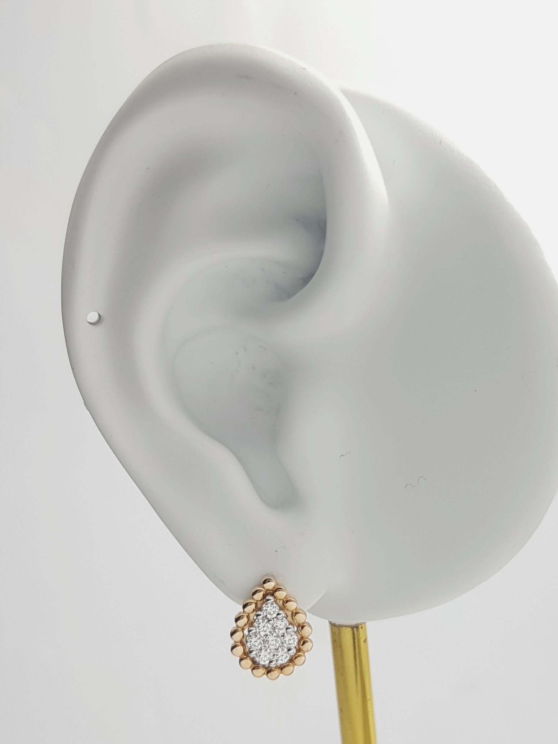 Orecchini con diamanti da 0,42 carati e montatura in oro rosa 18 carati

Larghezza: 0,9 cm 
Lunghezza: 1,1 cm
Peso totale: 4.19 grammi

