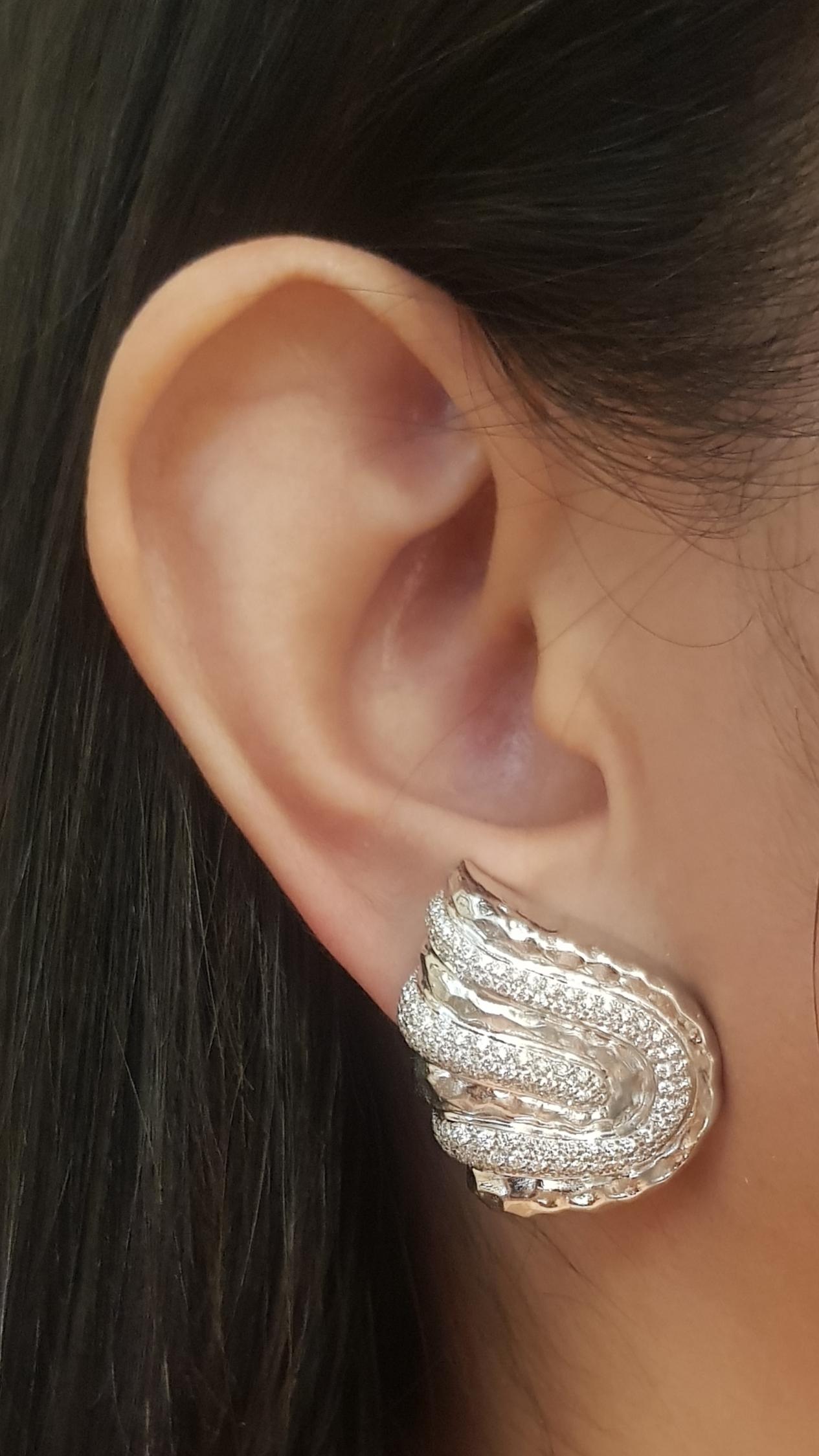 Diamond 1.68 carats Earrings set in 18K White Gold Settings

Width: 2.1 cm 
Length: 2.7 cm
Total Weight: 22.74 grams

