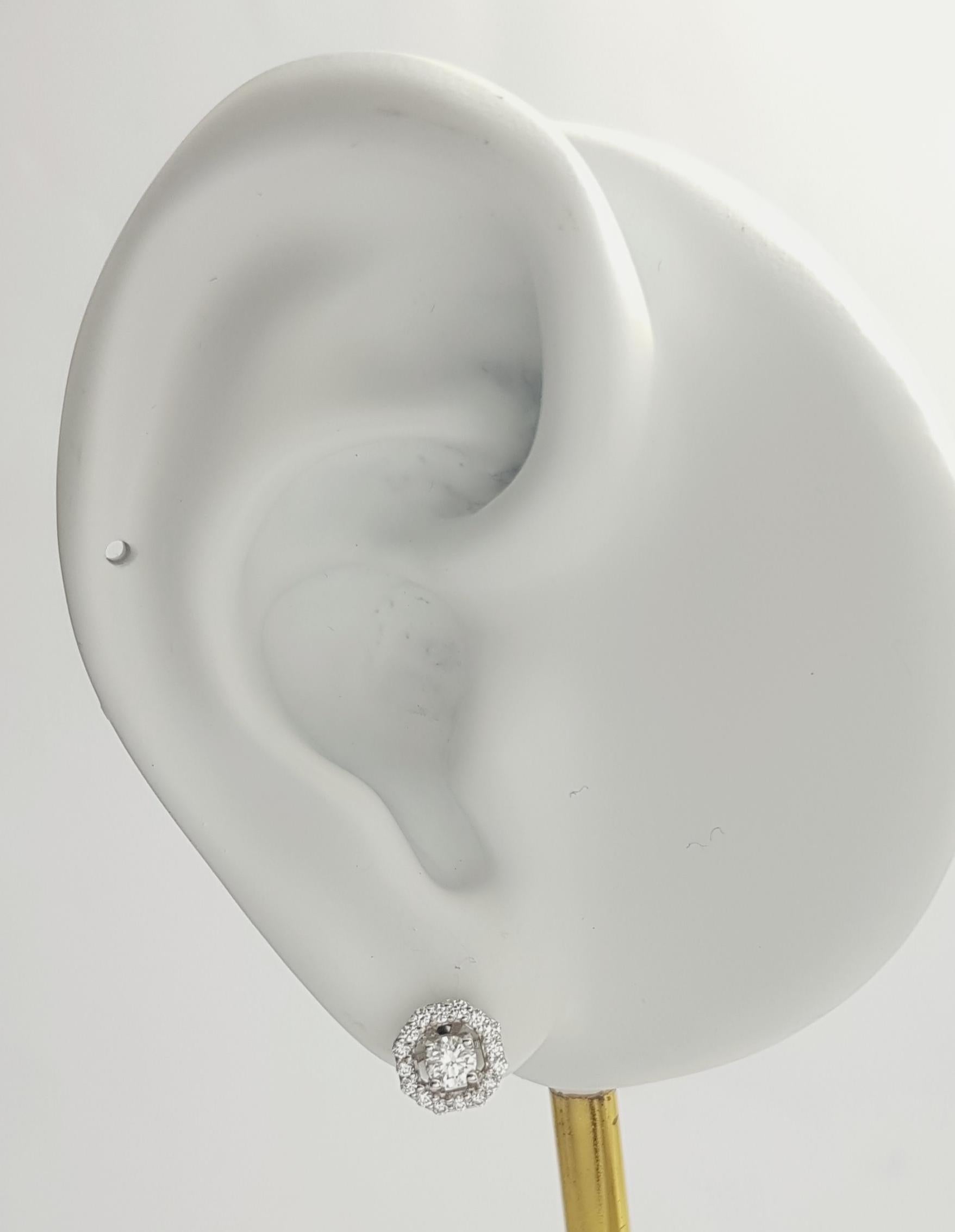 Diamond 0.38 carat Earrings set in 18K White Gold Settings

Width: 0.8 cm 
Length: 0.8 cm
Total Weight: 2.35 grams

