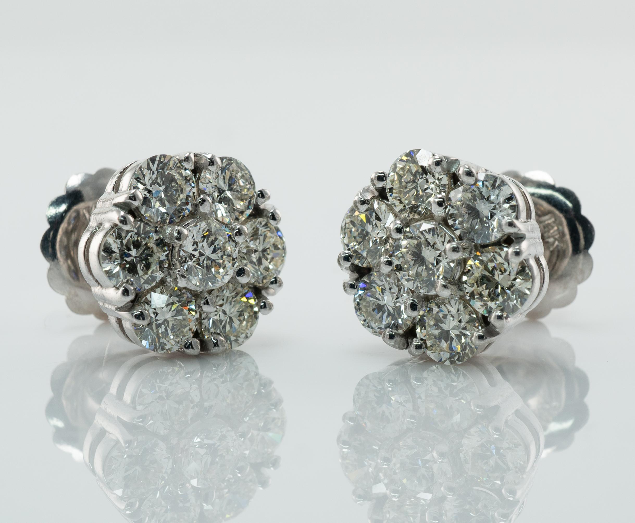 Diamond Earrings Studs 14K White Gold Cluster  4.20 TDW

This pair of diamond cluster studs is crafted in solid 14K White Gold (tested and guaranteed). 
There are seven natural round brilliant cut diamonds totaling 4.20 carats for the pair.
 The