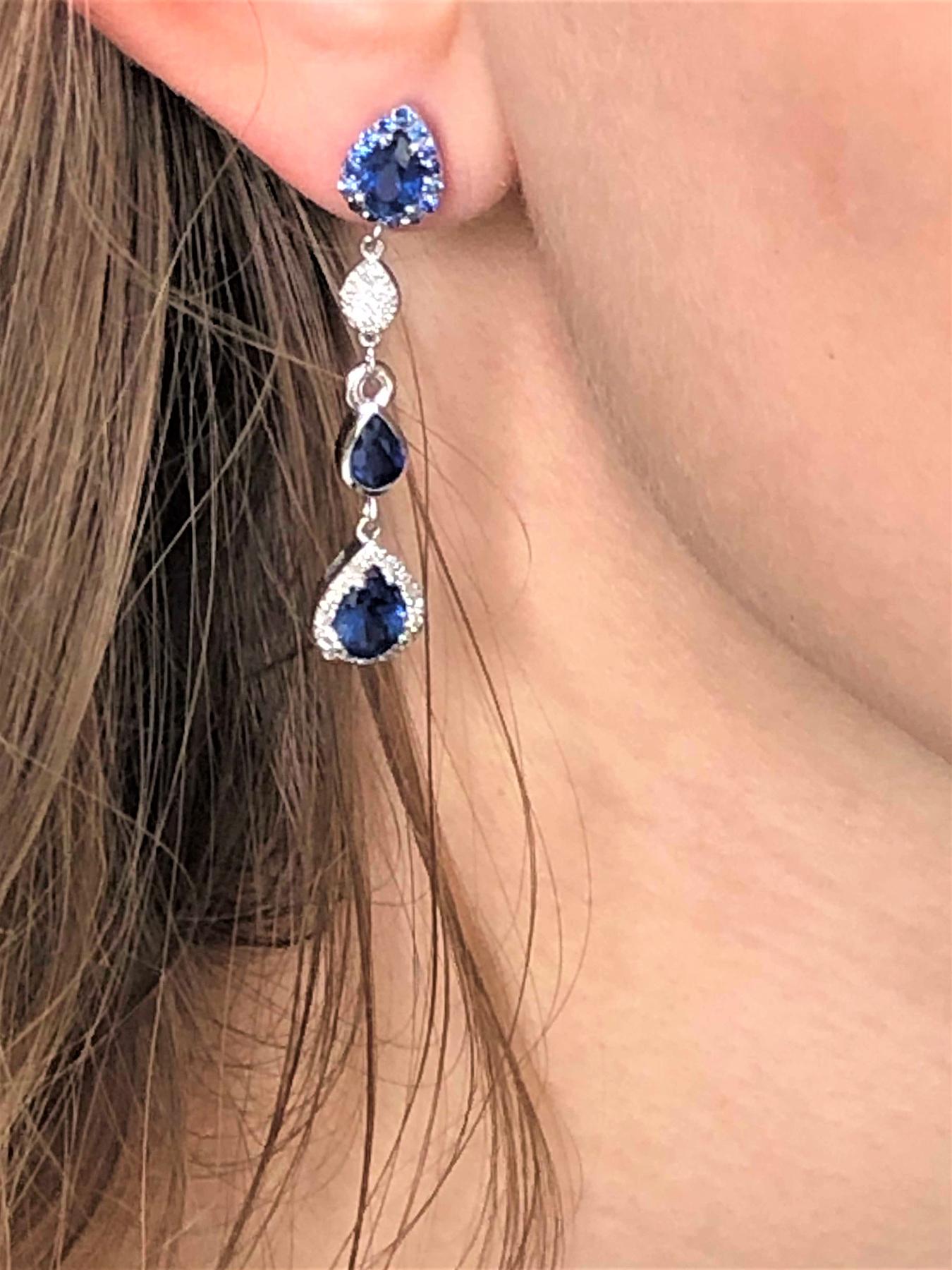 14 karat white gold drop earrings two inch long
Diamonds weighing 1.25 carat 
Pear shape sapphires weighing 3.65 carat
One of a kind earring
New Earrings
Handmade in the USA
The 14 karat gold earrings are hanging off a post with push backs
Our team