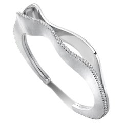 STRATUM BANGLE White gold with a single diamond edge by Liv Luttrell