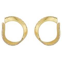 TWIST HOOP EARRINGS  Yellow gold with a warm-tone diamond edge by Liv Luttrell