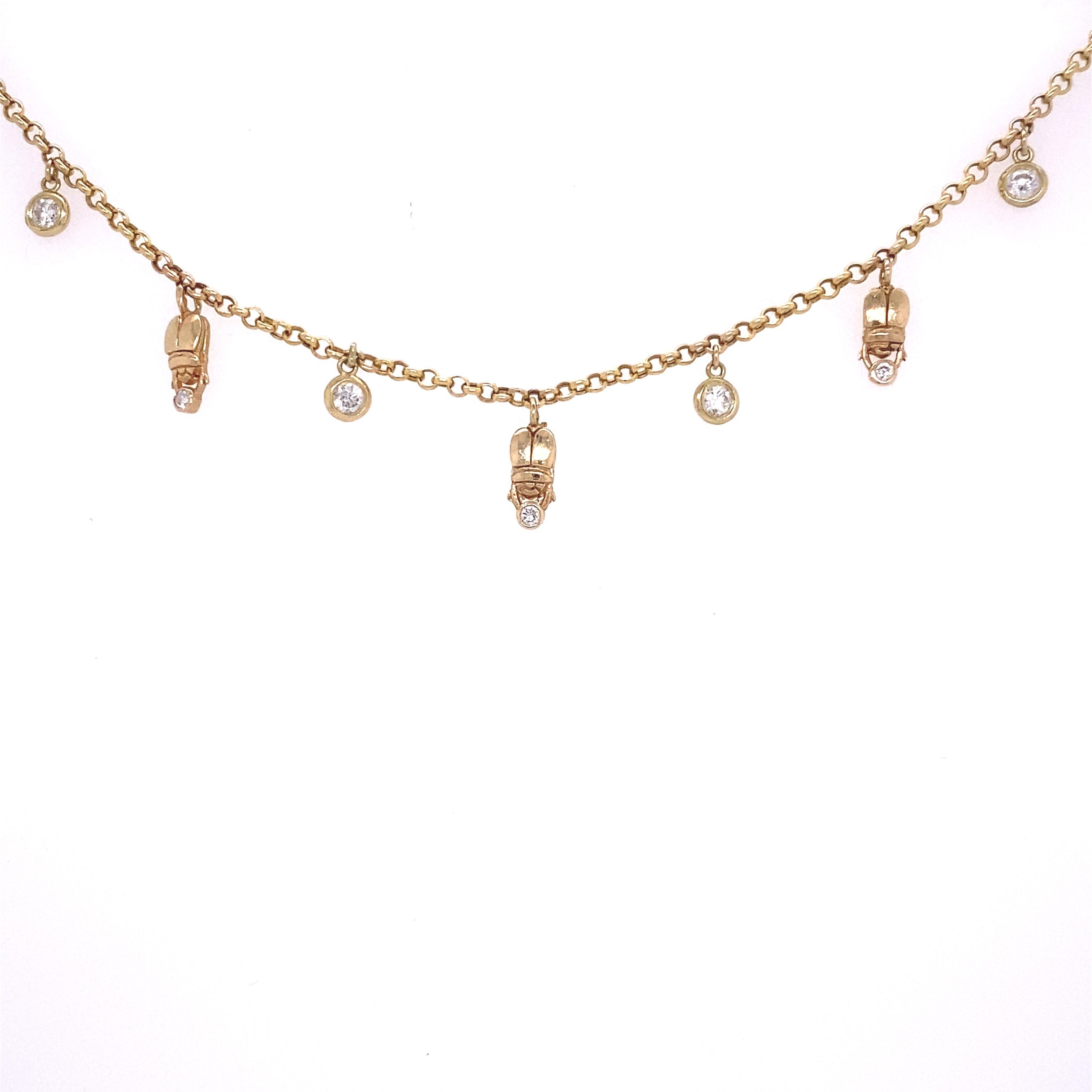Diamond Egyptian Scarab Choker in 14 Karat Yellow Gold 

This dangly diamond choker is absolutely gorgeous. Featuring hand carved Egyptian scarabs holding a diamond, and spaced between bezeled round VS diamonds. Total diamond weight is 0.40 carats,