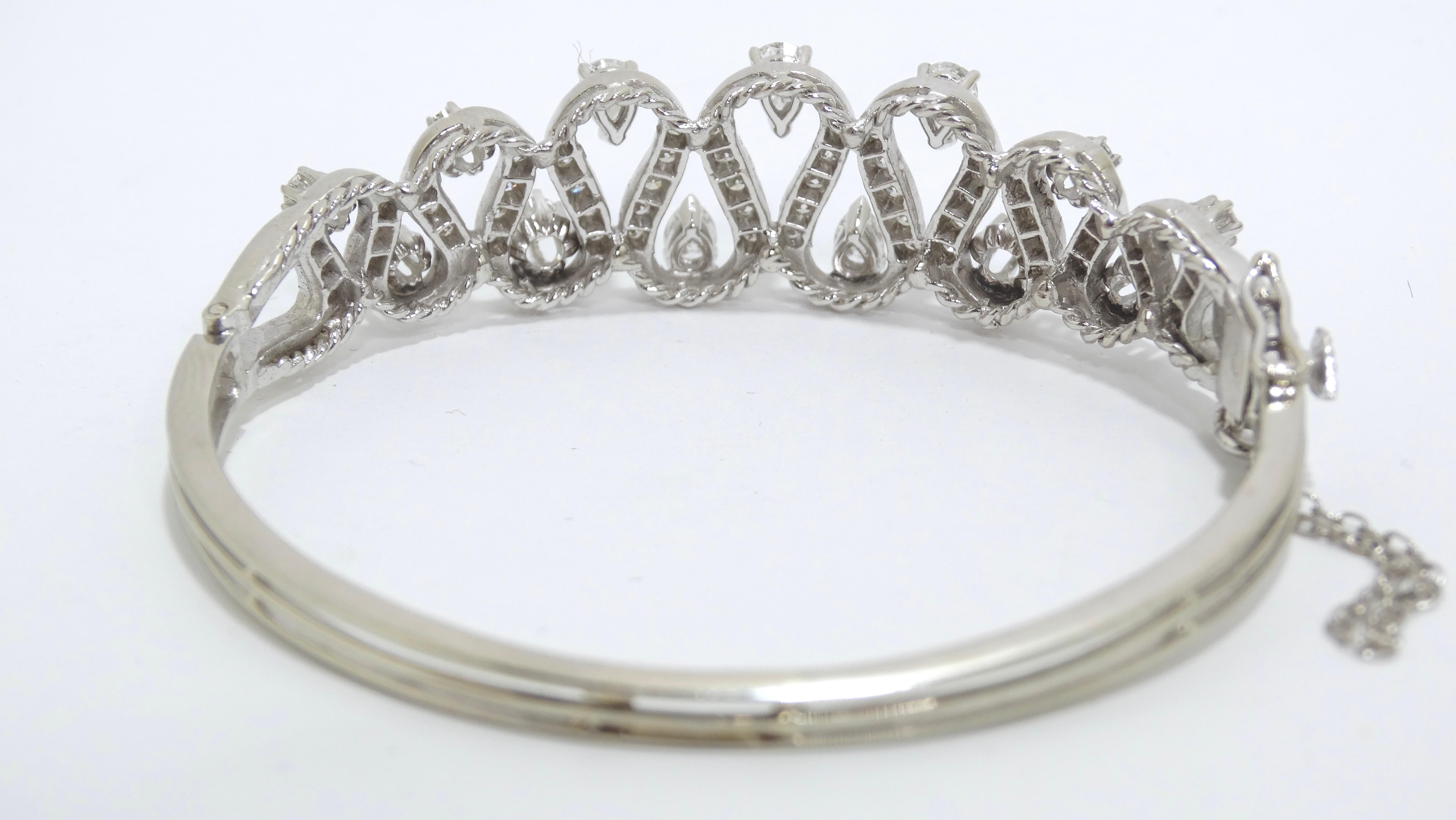 This bracelet will never have you reaching for your plain option again! Beautiful detailing paired with 3ctw Diamonds will be your finishing touch to your future night look. Details include a unique curved detailing and adornments of small and large