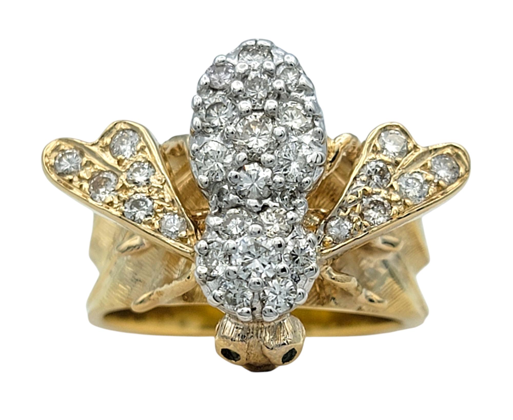 Ring Size: 8 

Embrace nature-inspired luxury with this exquisite diamond honey bee ring, a dazzling blend of artistry and elegance. Crafted in a striking combination of 14 karat white and yellow gold, this unique piece features a beautifully