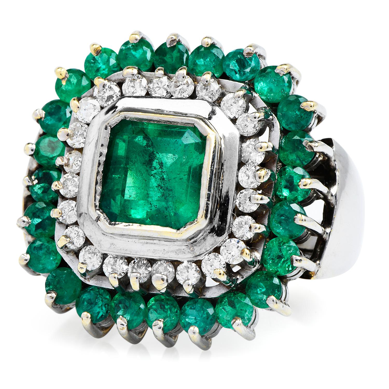 A Double Halo of Elegance and Distinction, 

This exquisite Cocktail Ring is centered with one vibrant high-quality Emerald cut Emerald approx: 1.50 carats; Bezel set.

adorned with an inner square halo of 26 genuine round-cut Diamonds approx: 0.50 