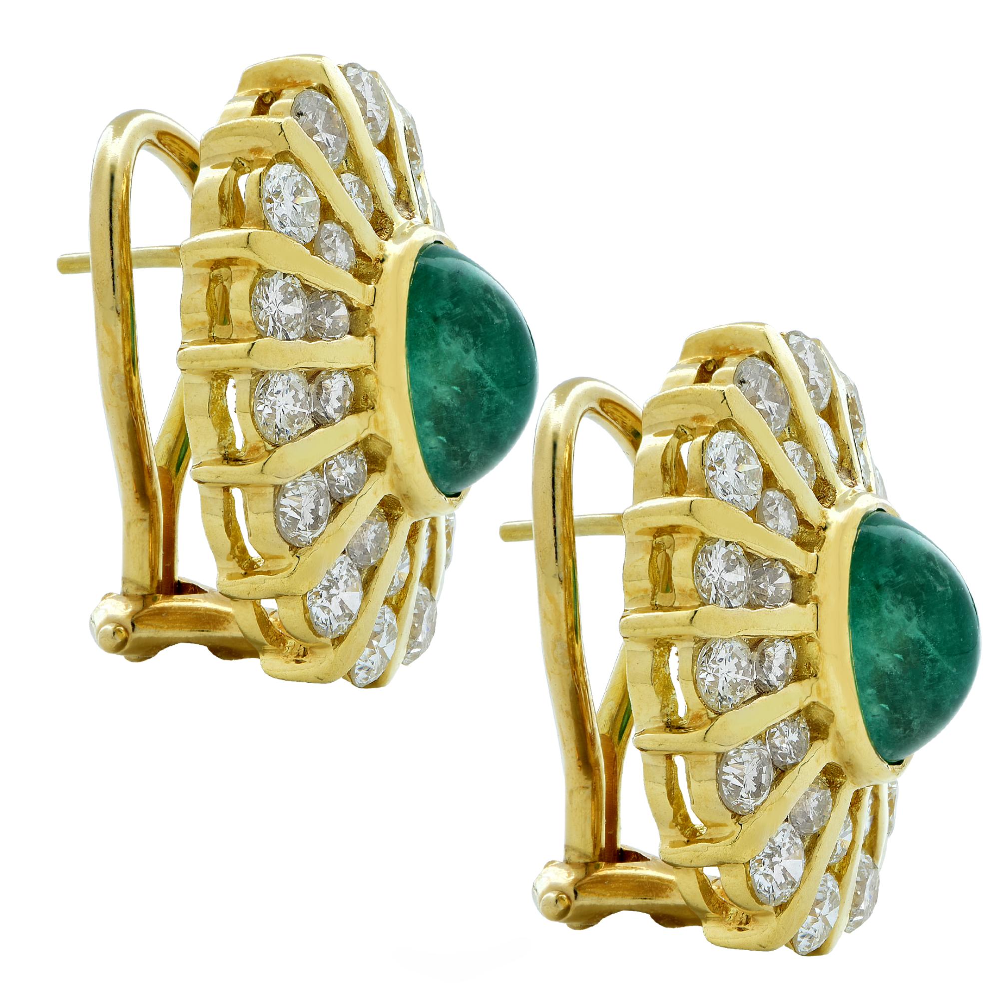 Attractive stud earrings crafted in 18 karat yellow gold featuring two gorgeous cabochon emeralds weighing approximately 3 carats total weight, adorned with 56 round brilliant cut diamonds weighing approximately 4.50 carats, H-I color, SI clarity.