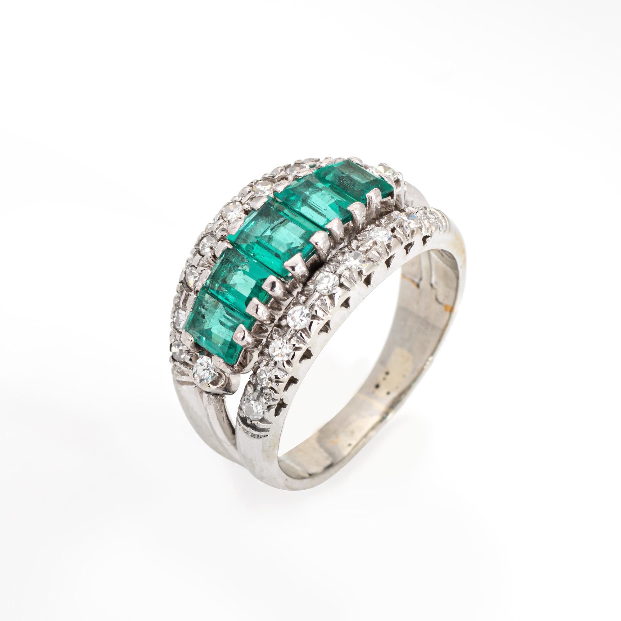 Stylish and finely detailed diamond & emerald ring crafted in 18 karat white gold (circa 1960s to 1970s).

20 single cut diamonds total an 0.10 carats (estimated at H-I color and SI1-I1 clarity). Five emerald cut emeralds measure from 4mm x 3mm to