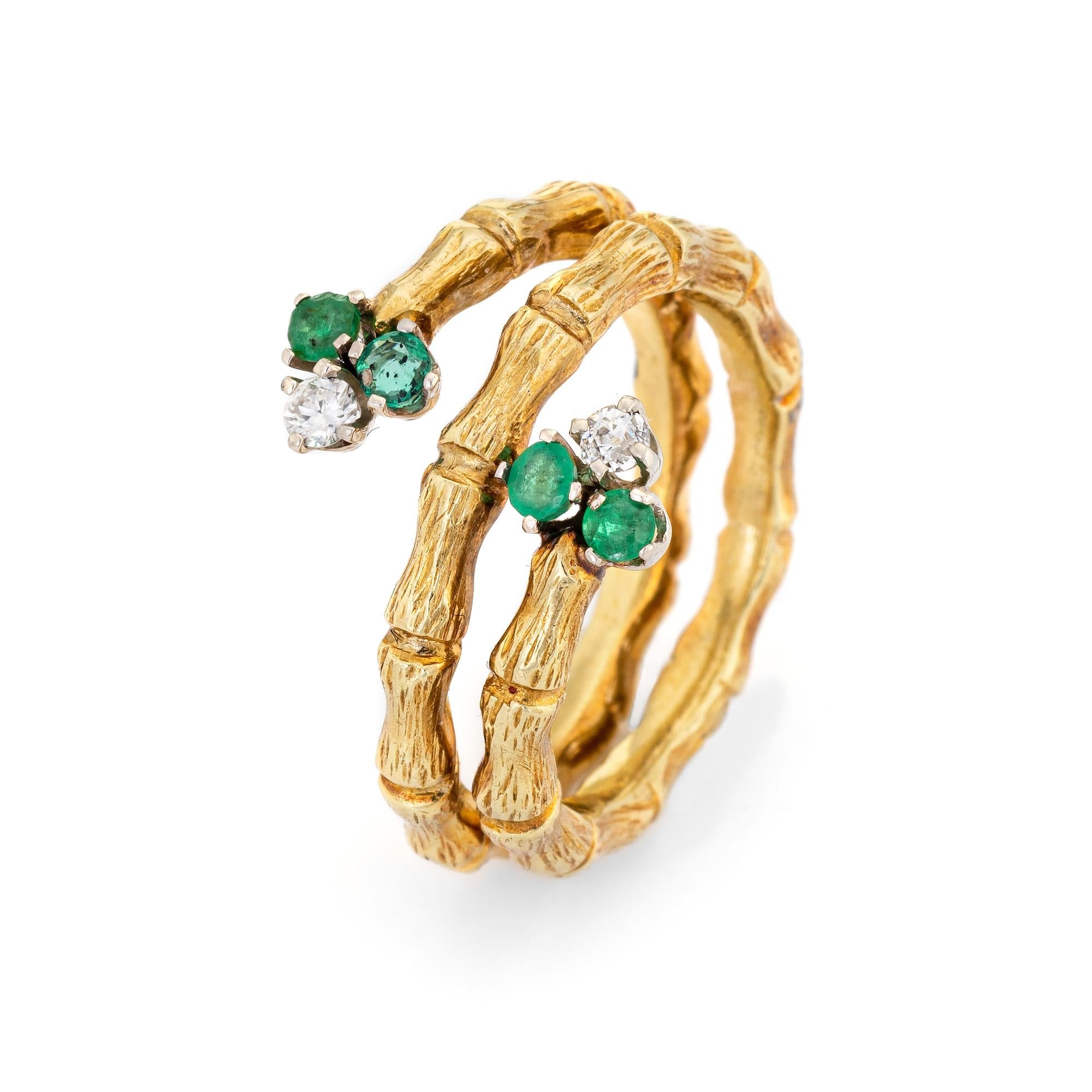 Stylish vintage emerald & diamond bamboo ring (circa 1970s) crafted in 18 karat yellow gold. 

Four estimated 0.04 carat emeralds (0.16 carats total estimated weight) and two estimated 0.05 carat round brilliant cut diamonds. The diamonds total an