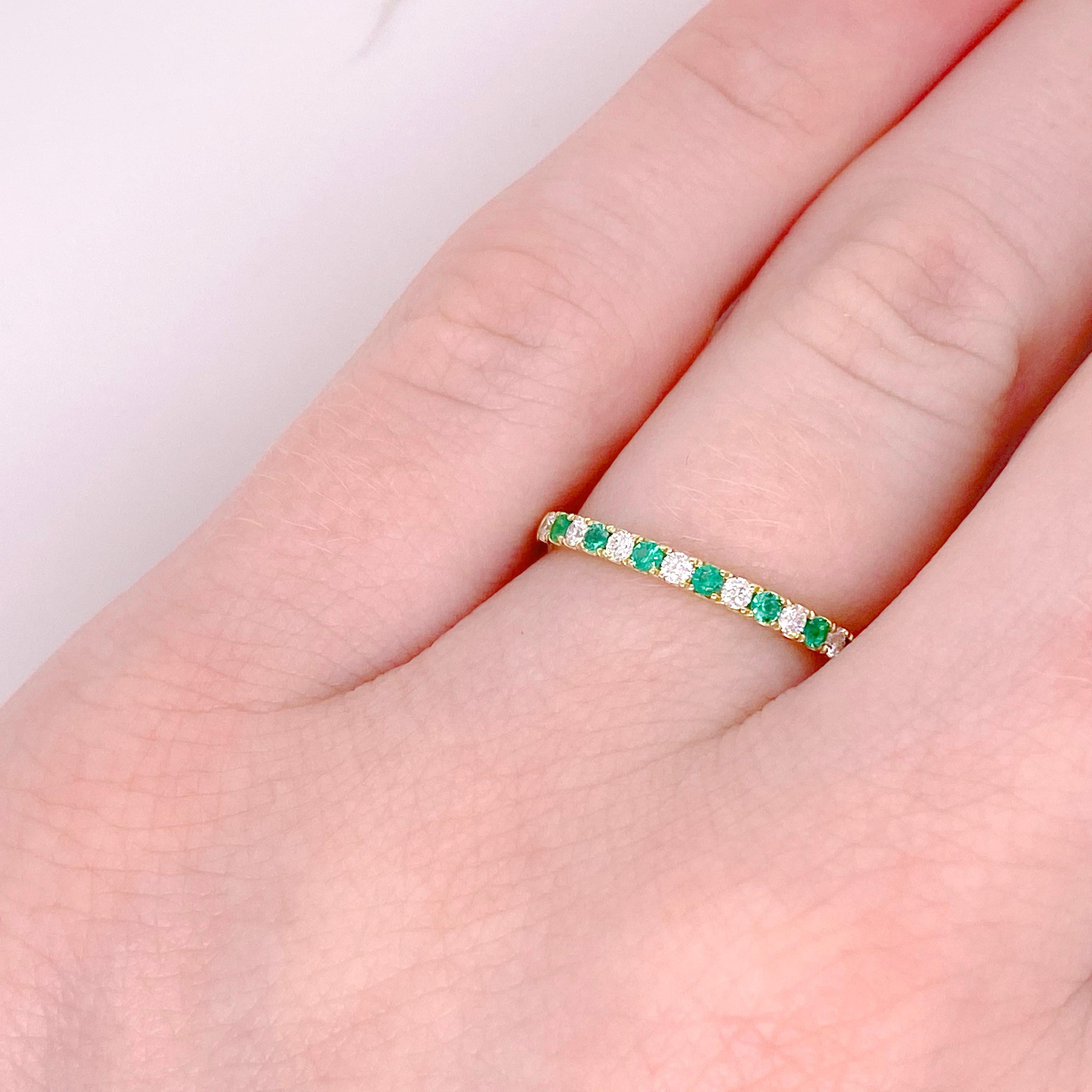 The green emerald and white diamond ring is a lovely band for a wedding band, anniversary band or a stackable band. The 14 karat yellow gold band is really excellent quality and is something that will be cherished forever. The details for this