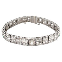 Bracelet en platine avec diamants et émeraudes