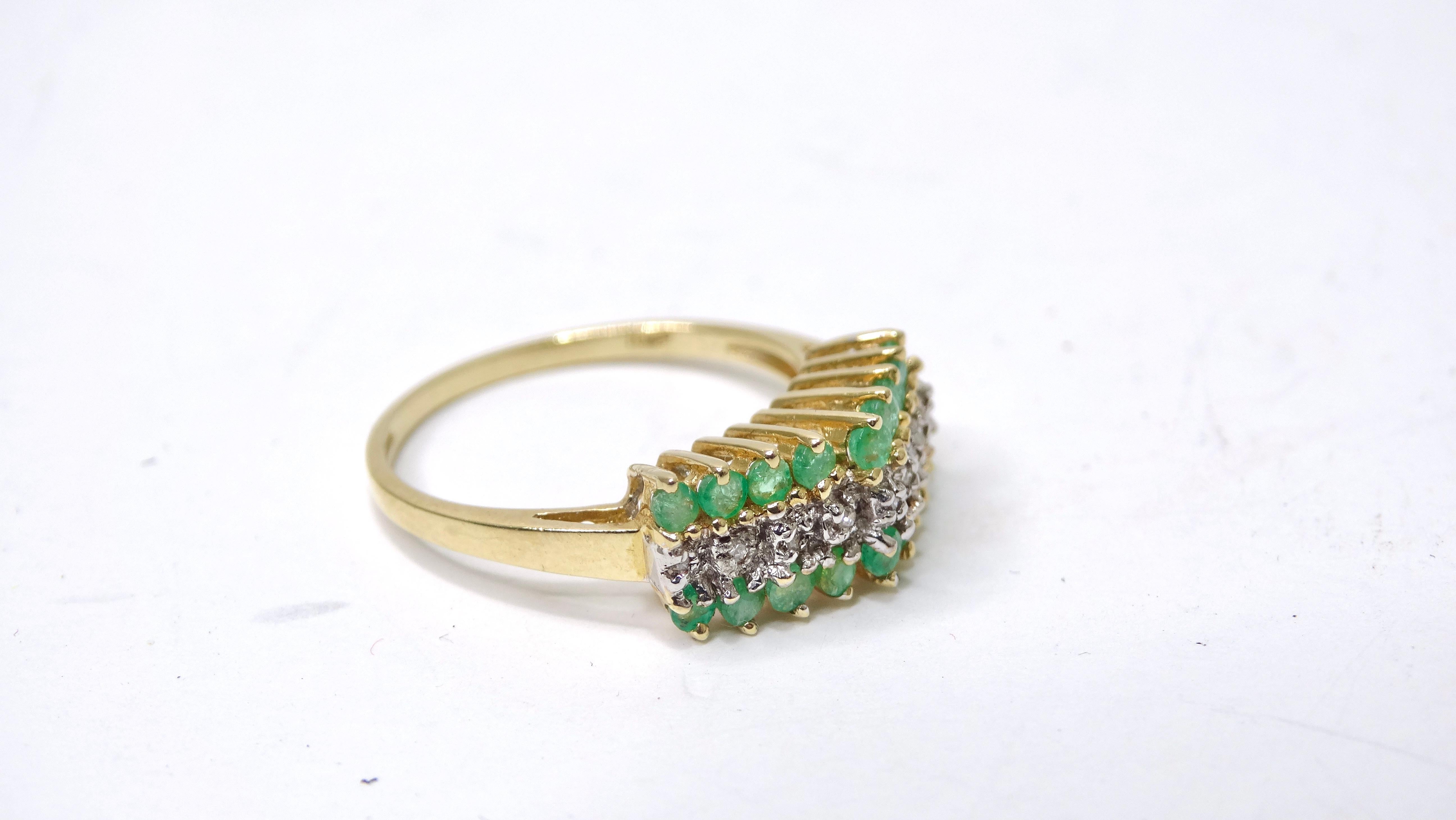 This ring is eye-candy! The sparkle and detail will have you drooling. There is something so effortless and interesting about a clustered ring. This ring features a yellow 14k gold band that still has a bright and bold color with 18 emeralds and 9