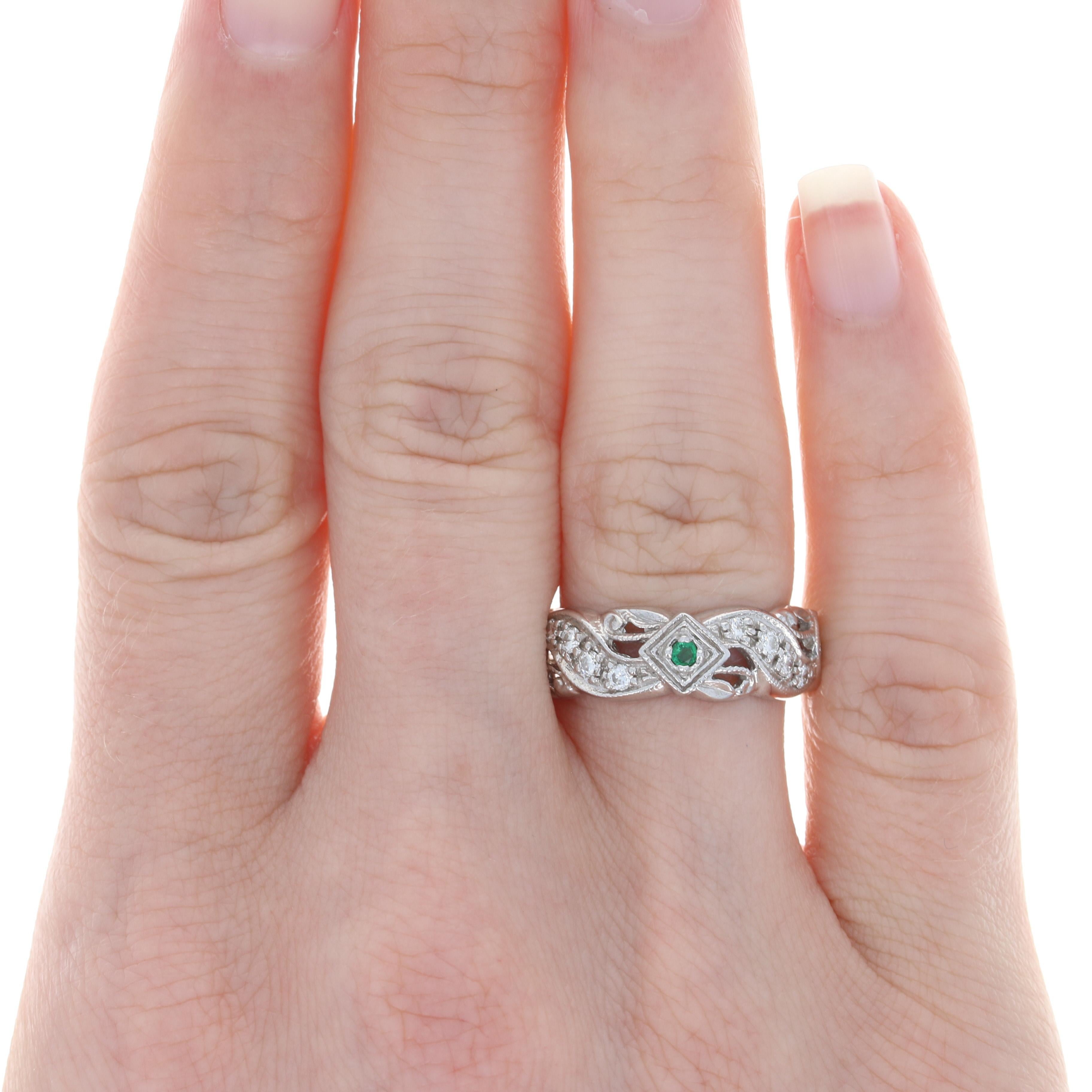 On a special night out, get ready to dazzle wearing this gorgeous diamond and emerald cocktail ring! Crafted in luxurious 18k white gold, this ring vintage-style is fashioned in a glorious eternity band style that showcases natural diamonds and