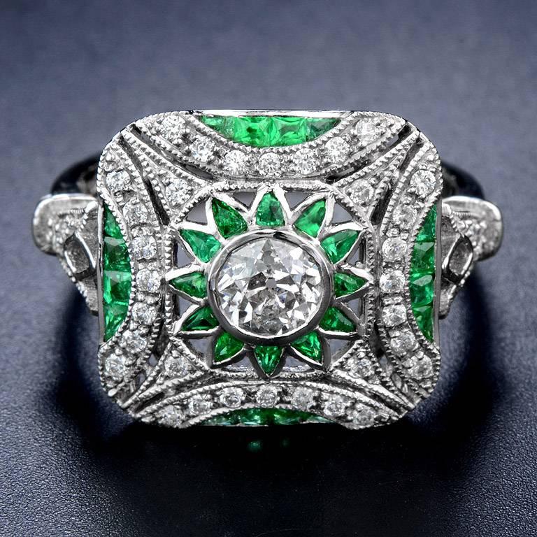 Center Diamond 0.44 Carat with Emerald from Zambia total weight 0.95 Carat also set with small Diamond 40 Pcs. total weight 0.33 Carat. on Platinum 950 Ring.