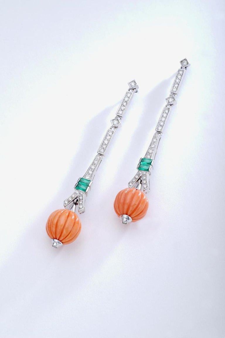Diamond, Emerald and Coral carved beads mounted on white gold Art Deco style Ear Pendants.
