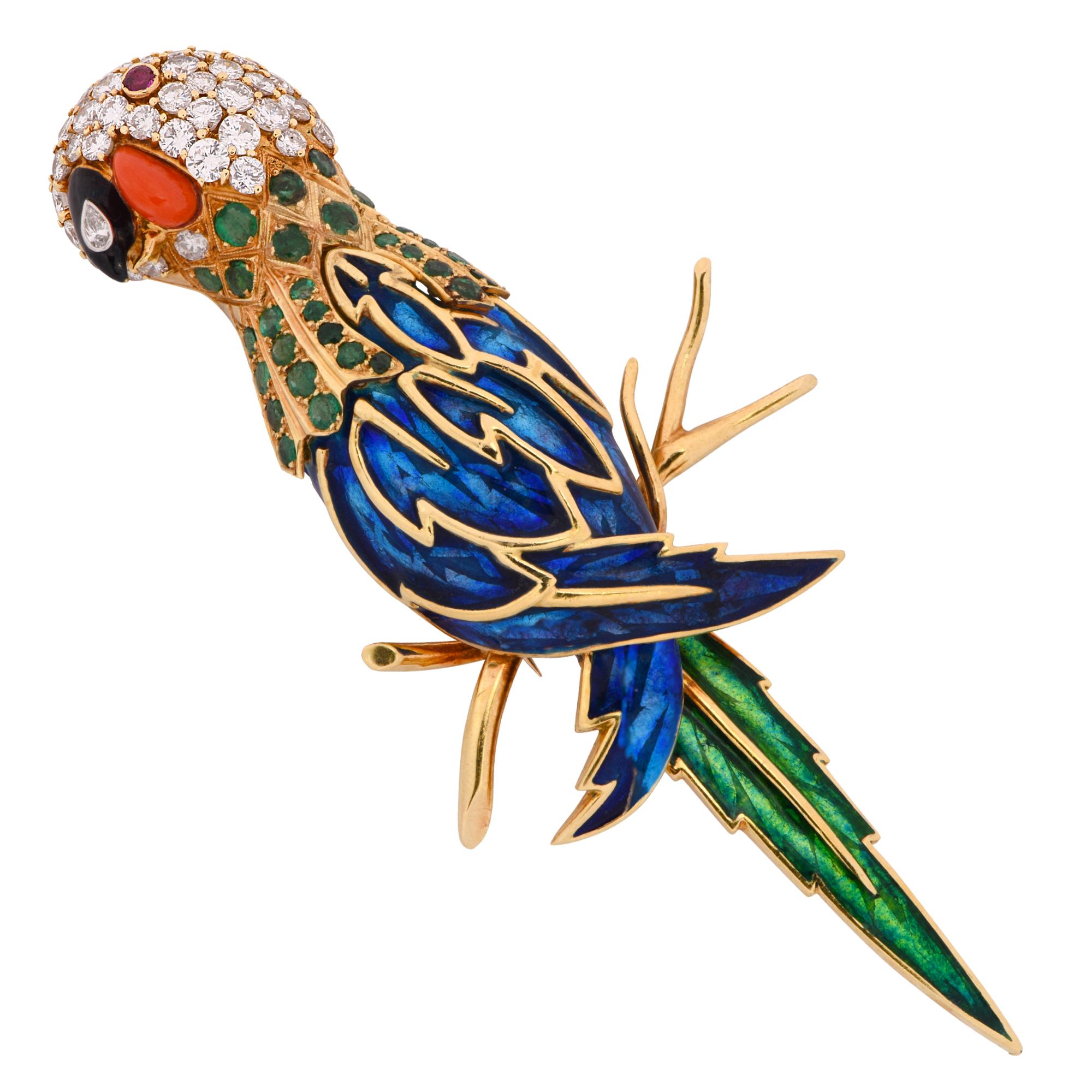 Delightful parrot brooch pin, crafted in 18k yellow gold, featuring approximately 8 carats of round brilliant cut diamonds, G color, VS clarity, accented by approximately 3 carats of round cut emeralds, a coral and onyx cabochon, and blue and green