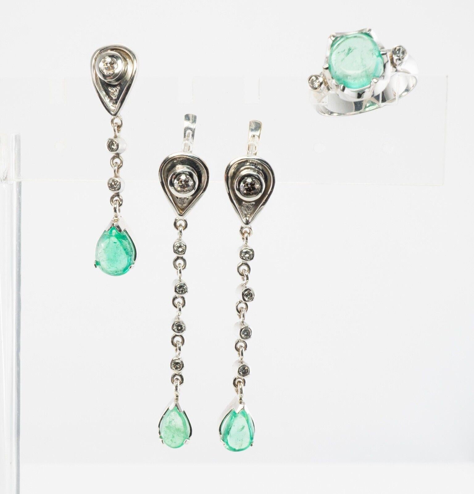 Diamond Emerald Earrings Emerald Ring Pendant Set 18K White Gold

This absolutely stunning vintage jewelry set is finely crafted in solid 18K White Gold. 
There are three pieces in this set: earrings, pendant, and the ring. 
The ring:
 The Emerald