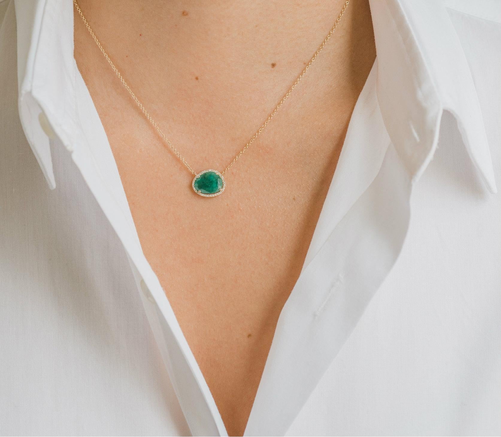 14k solid gold, pave diamond, and a beautifully handpicked free form emerald, available in yellow gold hanging from a 16''-18'' adjustable chain. Timeless and perfectly handcrafted, wear it up or down, by itself or layered.

Size of emerald: Approx.