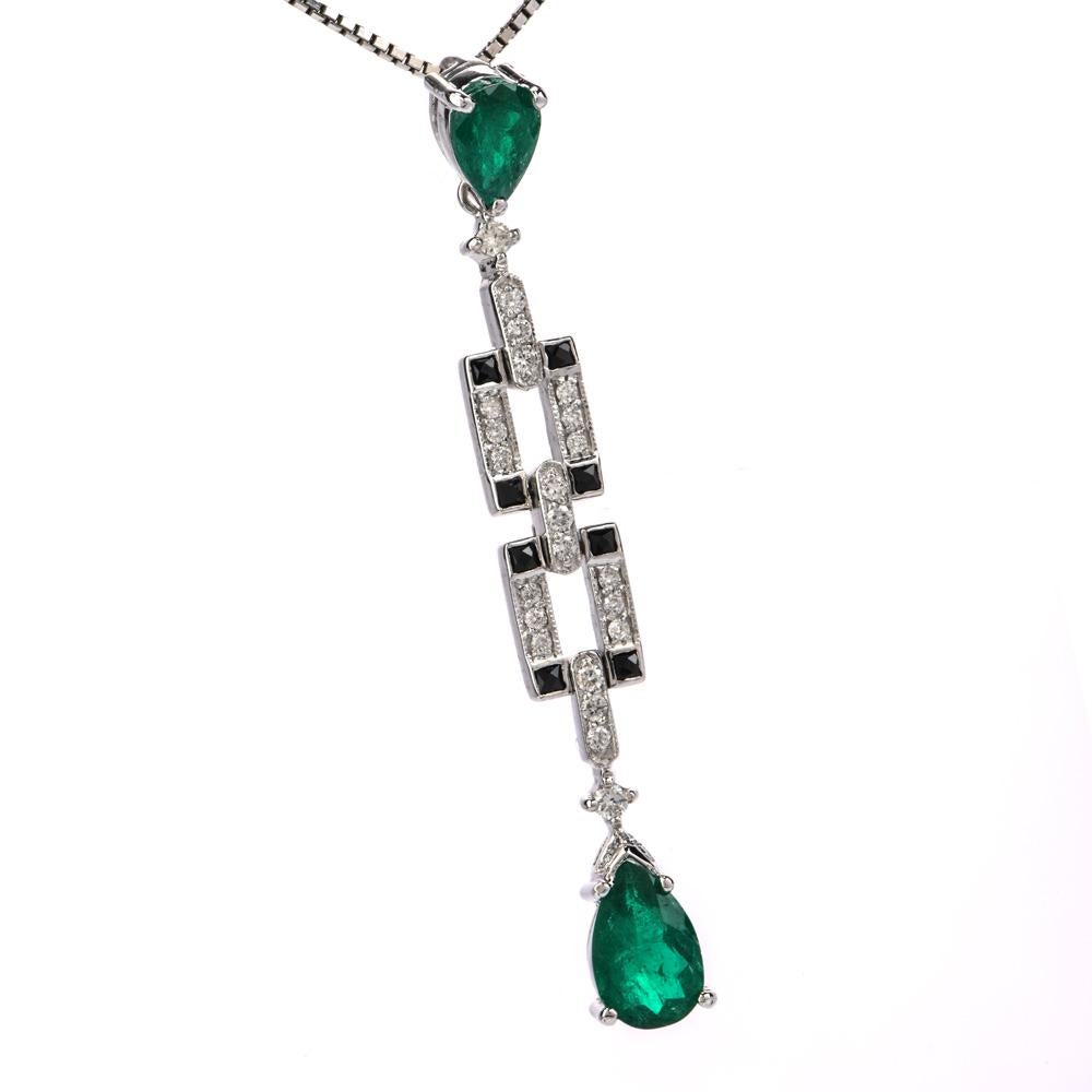 Place this exquisite and debonair deco style Diamond Emerald & Onyx 18K Gold Drop Pendant on your favorite gold chain*!

  This pendant is crafted in 18 karat white gold.  There are two genuine emeralds, pear shape, prong set, of approximately 1.80
