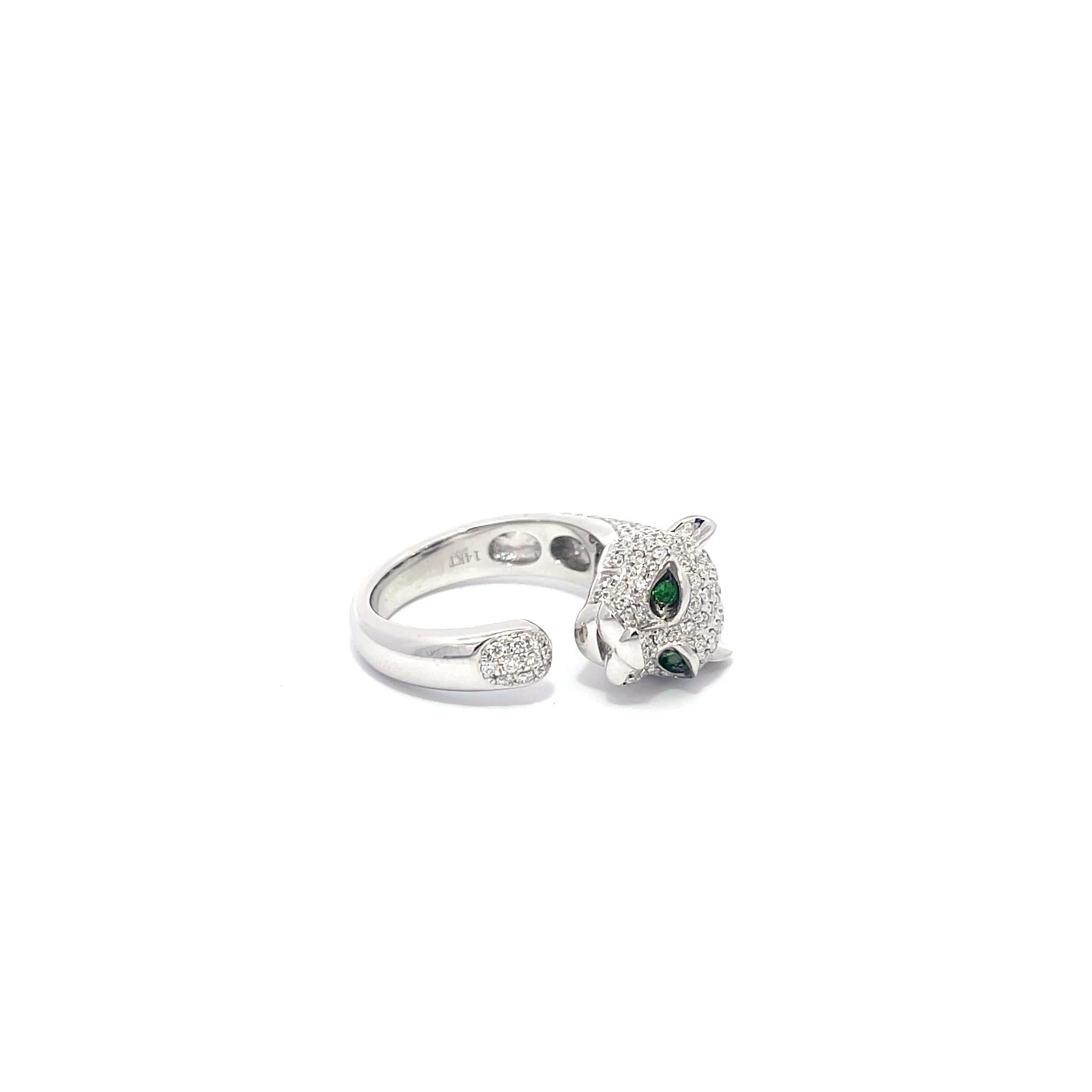 Diamond and Emerald Panther Ring in 14K White Gold. The ring features 1.02ctw of brilliant round cut diamonds and 0.04ctw emeralds. The ring is size 7 and weighs 8 grams.