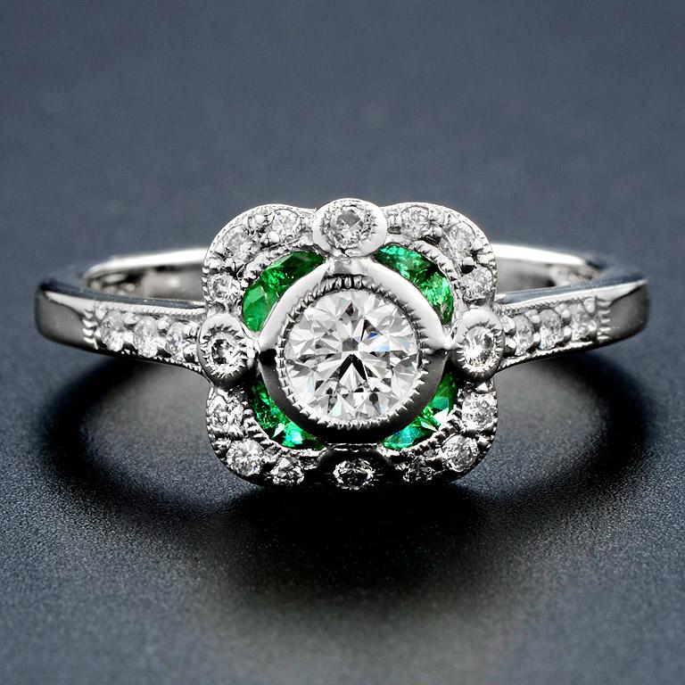 This Art Deco style ring was made in Platinum 950, the highest precious in metal.

The ring consists of...
Total Diamond 0.61 ct.
French Cut Emerald 0.23 ct.

The ring was made in size US#7
