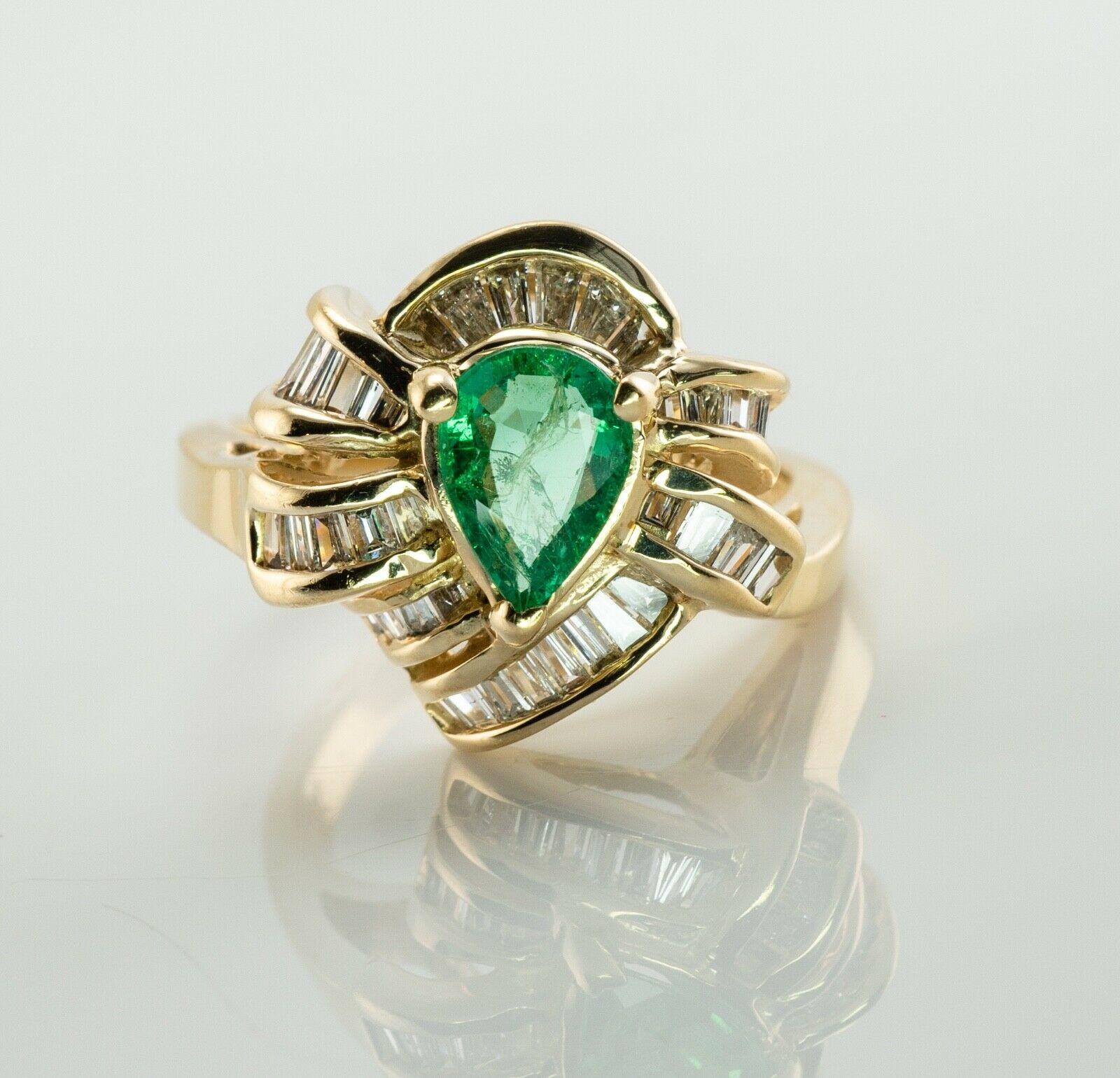 This beautiful estate ring is finely crafted in solid 14K Yellow gold and set with genuine Earth mined Emerald and natural diamonds. The center pear cut Emerald measures 7mm x 5mm (.70 carats), and this is a very clean and transparent gem of a great