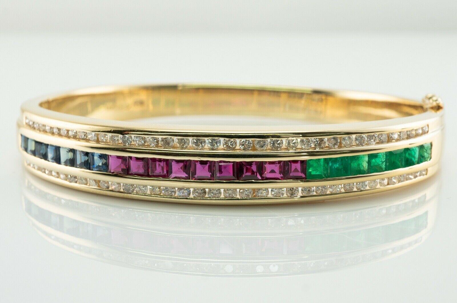 This amazing estate bracelet is finely crafted in solid 14K Yellow Gold and set with genuine Earth mined Emeralds, Rubies, Sapphires and Diamonds. There are 7 channel set emeralds, 9 Rubies, and seven sapphires. These gems are amazing quality, they