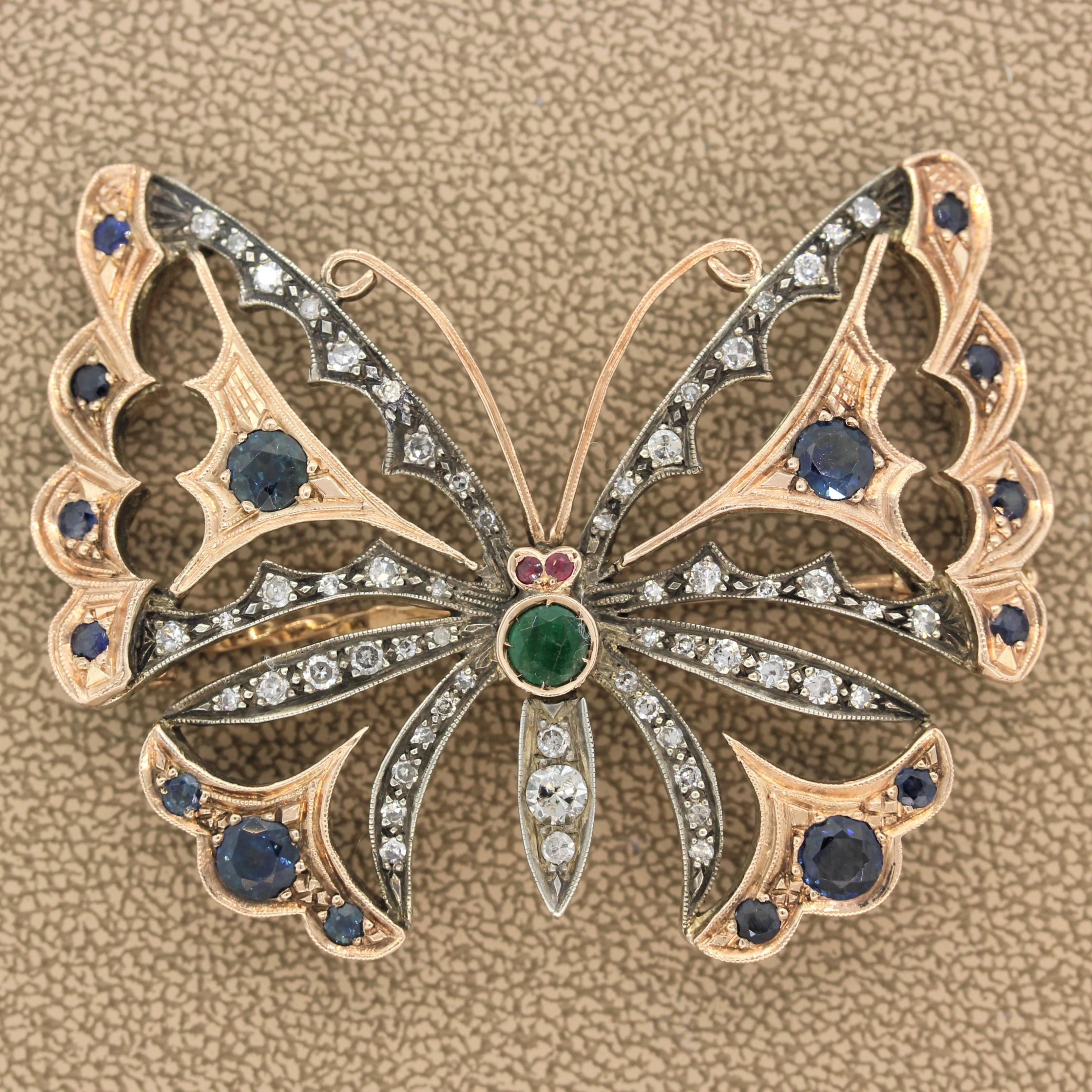 A regal estate butterfly with her wings spread to show her body of blue sapphires, colorless diamonds and a single emerald along with ruby eyes. This exceptional butterfly is made of 14K white and rose gold. 

Brooch Length: 2.25 inches 
Brooch