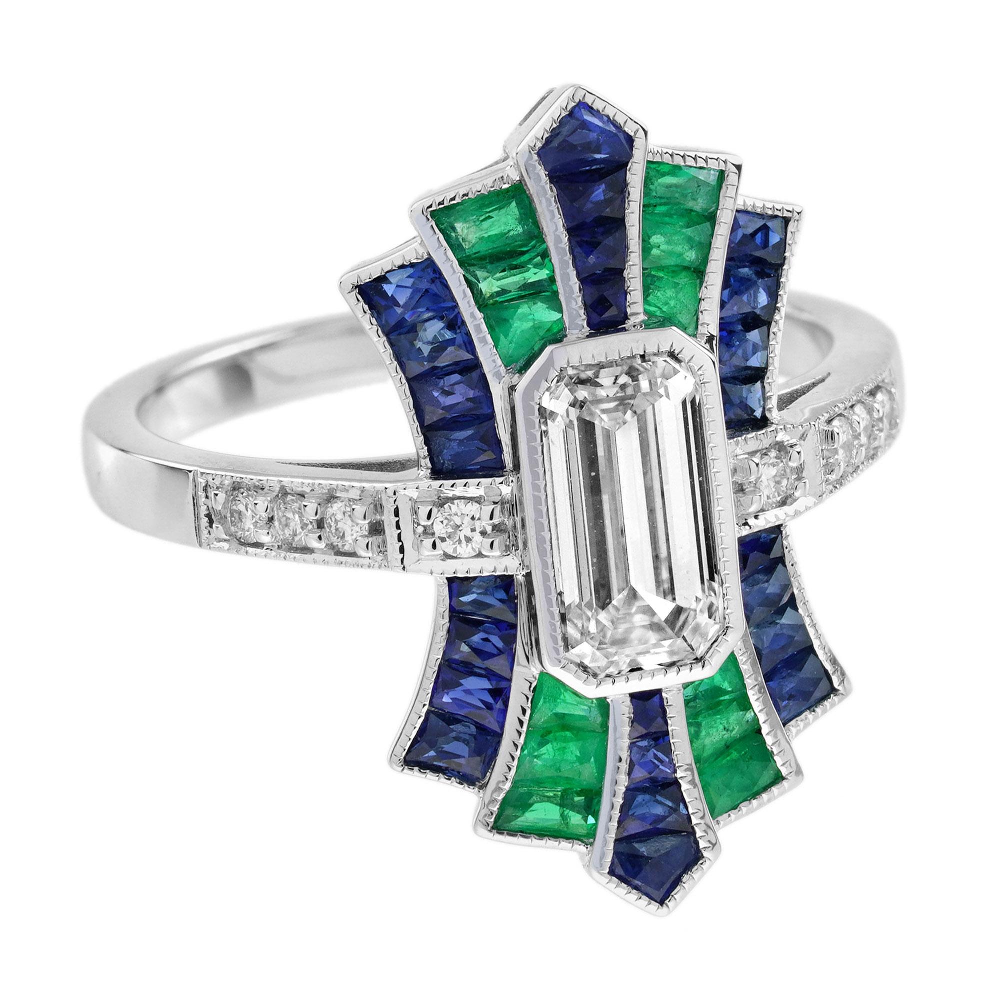 Con un diamante centrale da 1 carato con taglio a smeraldo che brilla con eccezionale chiarezza e brillantezza, questo splendido anello in stile Art Déco è un capolavoro di eleganza. Il diamante centrale è affiancato da pietre di smeraldo e zaffiro,