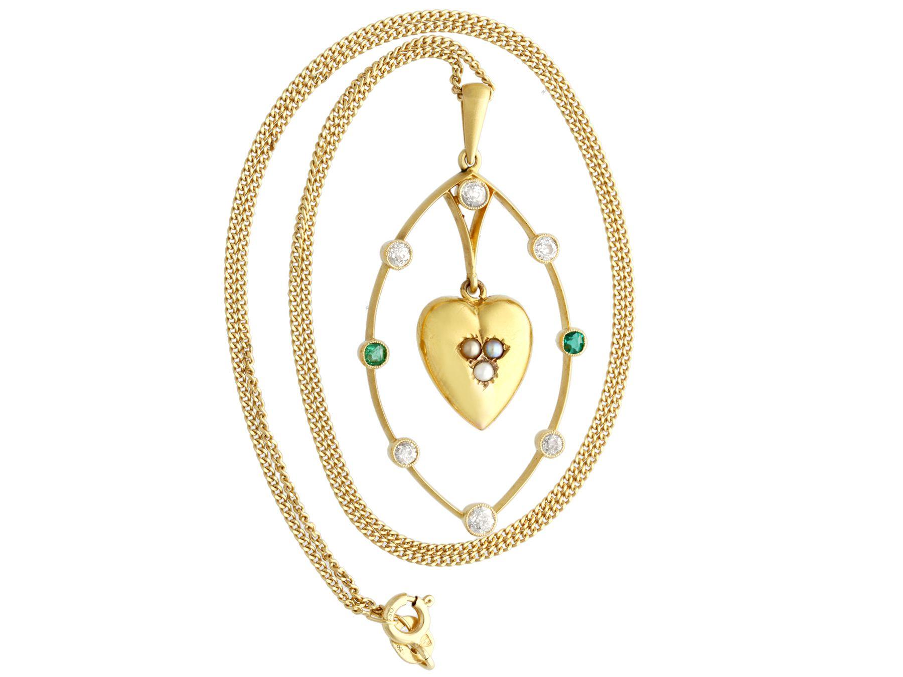 A fine and impressive antique Victorian 0.51 carat diamond, 0.10 carat emerald, seed pearl and 18 carat yellow gold heart pendant; part of our our diverse antique emerald pendant collections.

This impressive antique Victorian pendant has been