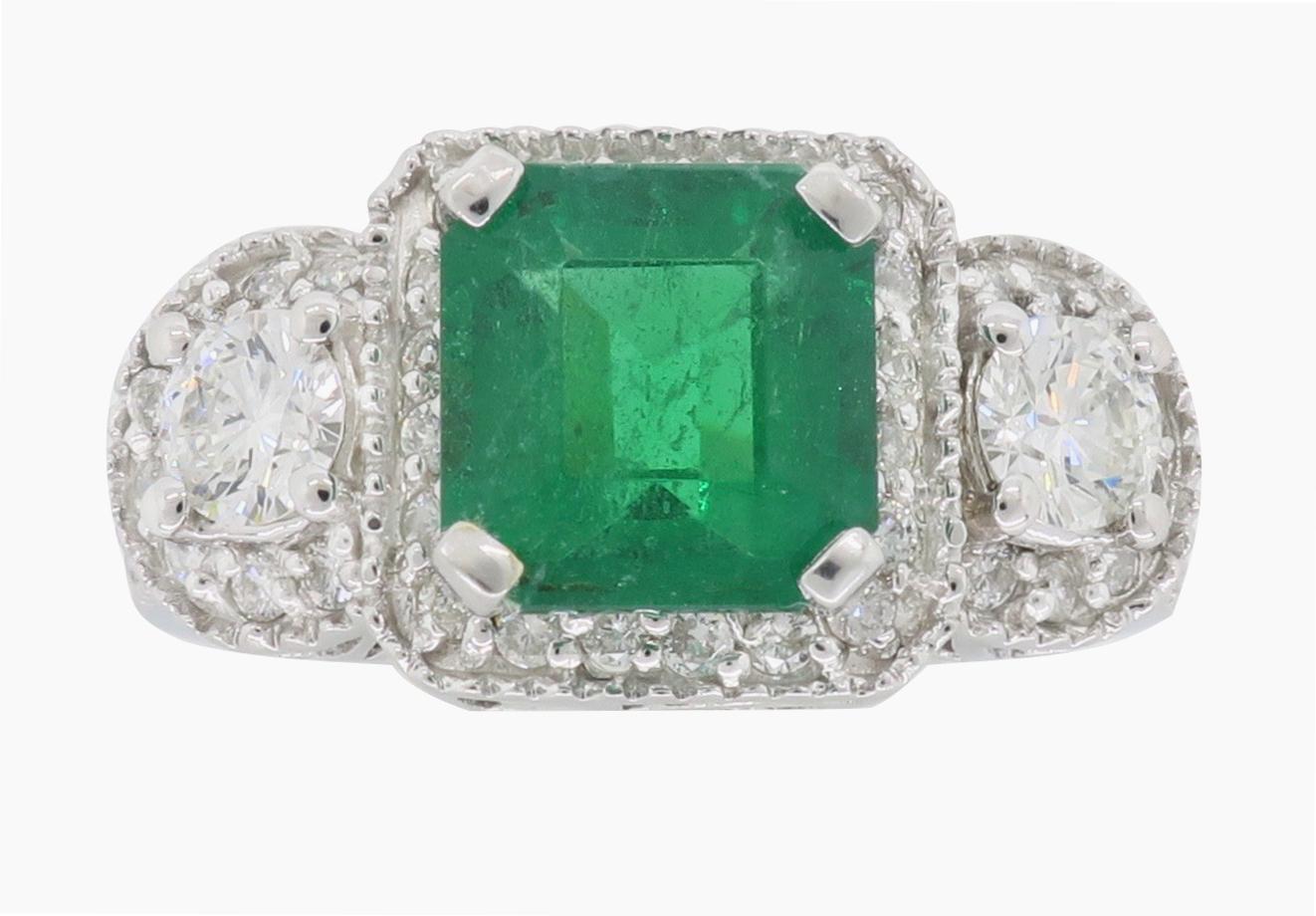 Asscher Cut Emerald and Diamond cocktail ring set in 14K white gold.

Gemstone: Emerald & Diamond
Gemstone Carat Weight: Approximately 2.35CT Asscher Cut Emerald 
Diamond Carat Weight: Approximately Approximately 1.09CTW
Diamond Cut: Round