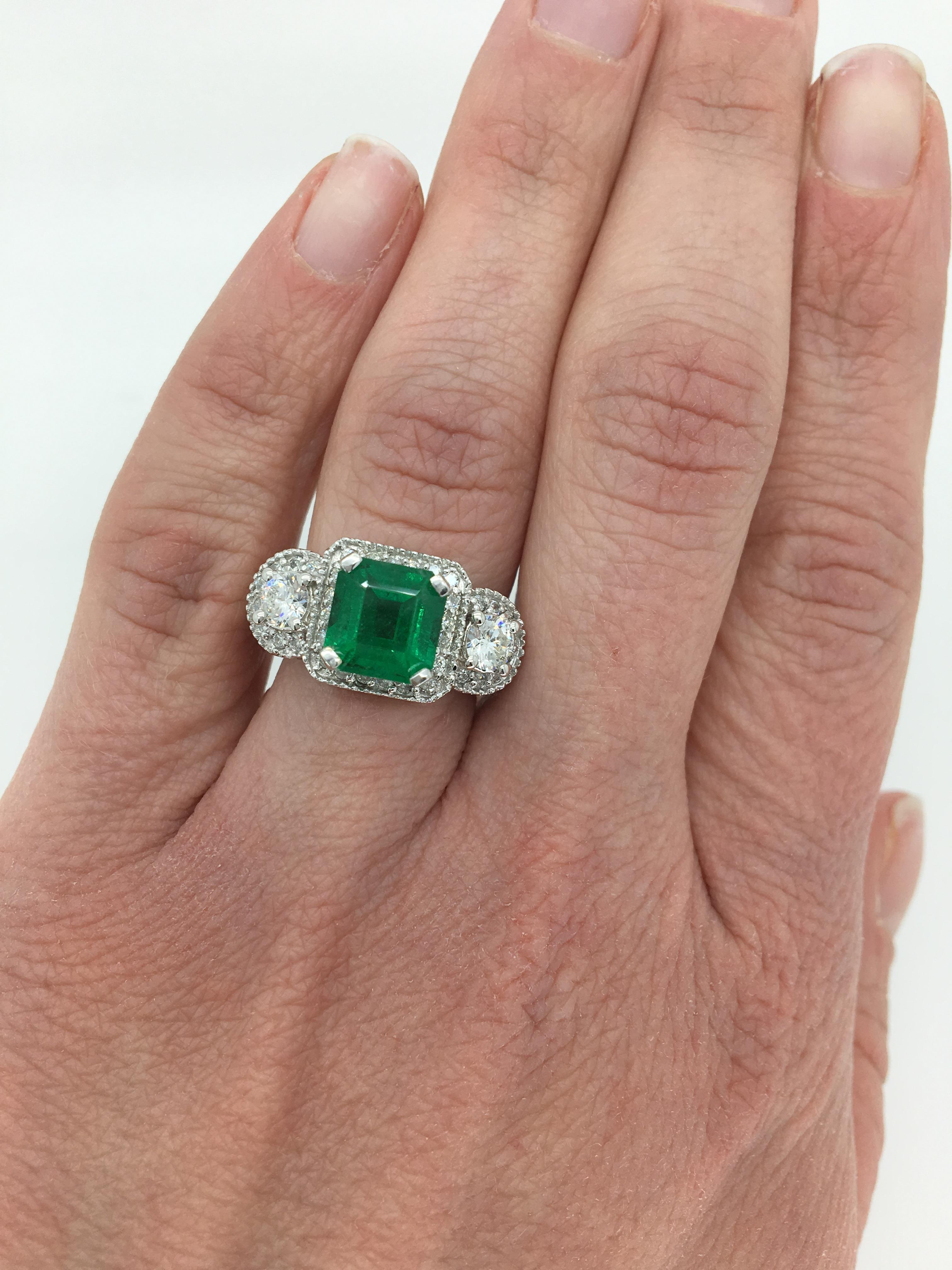 emerald three stone ring