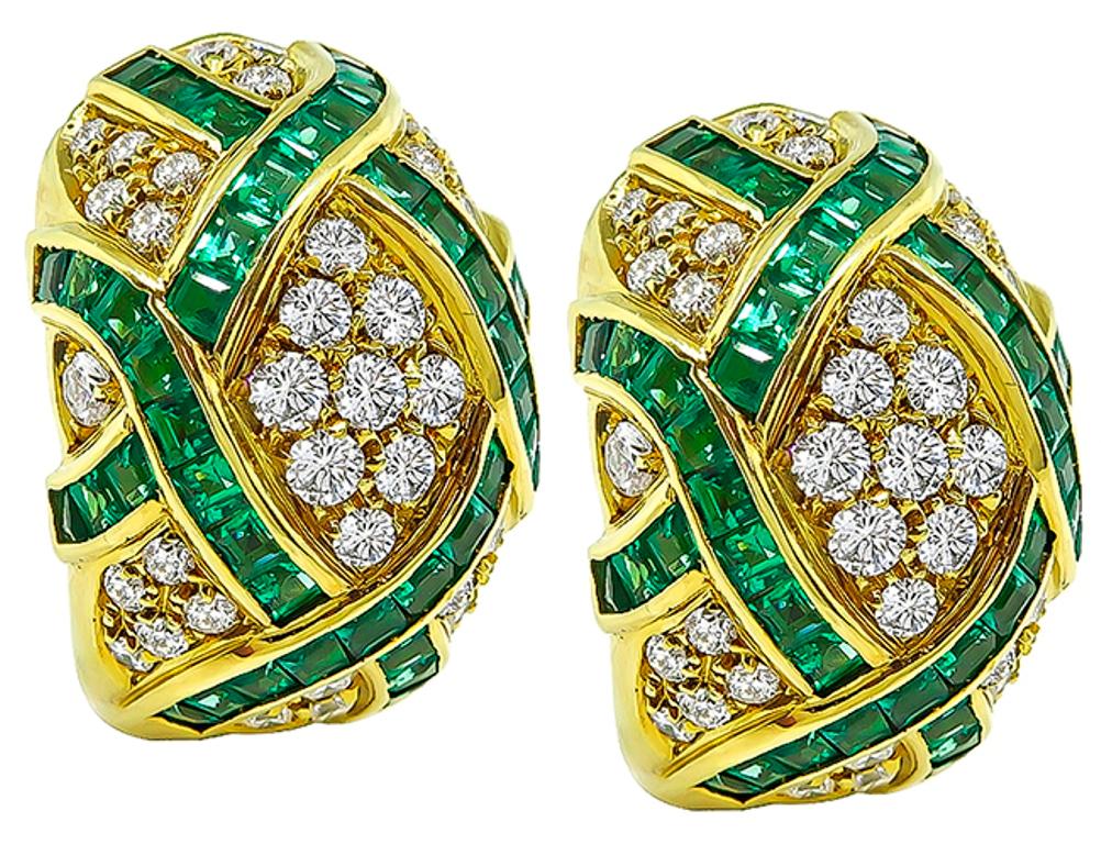 This is a stunning pair of 18k yellow gold earrings feature sparkling round cut diamonds that weigh approximately 4.00ct. graded E-F color with VS clarity. The diamonds are accentuated by lovely square cut Colombian emeralds that weigh approximately