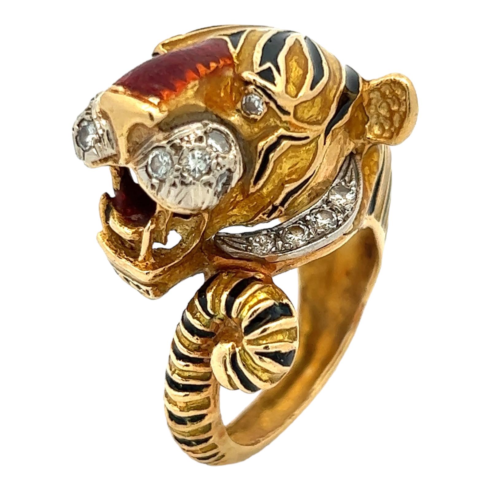 Diamond and enamel tiger cocktail ring crafted in 18 karat yellow gold. The tiger head ring is set with 16 round brilliant cut diamond accents weighing approximately .30 CTW (graded H-I/SI). Black and orange enamel adorn the entire ring which is