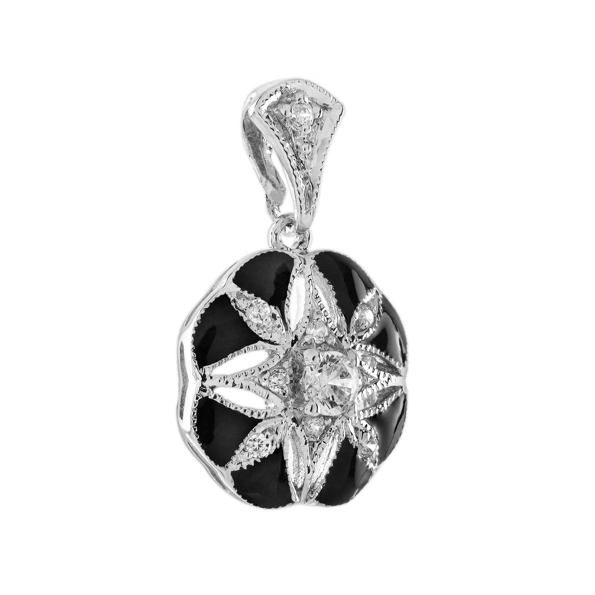 Le pendentif floral de style Art déco en or blanc 14 carats émaillé de diamants est un parfait mélange de force et de douceur. Son audacieux motif floral Art déco, rehaussé de diamants brillants et d'un riche émail noir, en fait une pièce à la fois