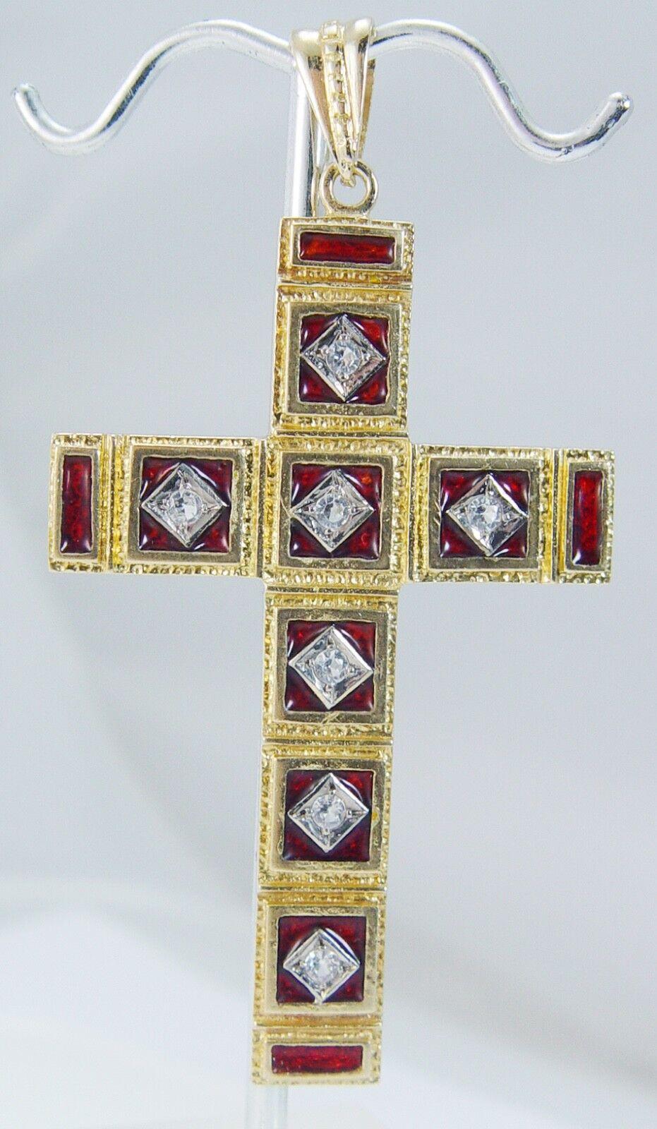 Diamond Enamel Cross Pendant 18K Gold Vintage

This very different and unusual diamond Cross is finely crafted in solid 18K Yellow Gold. The Red enamel is in excellent condition. Seven single cut Diamonds total .28 carat of VS2 clarity and H color.