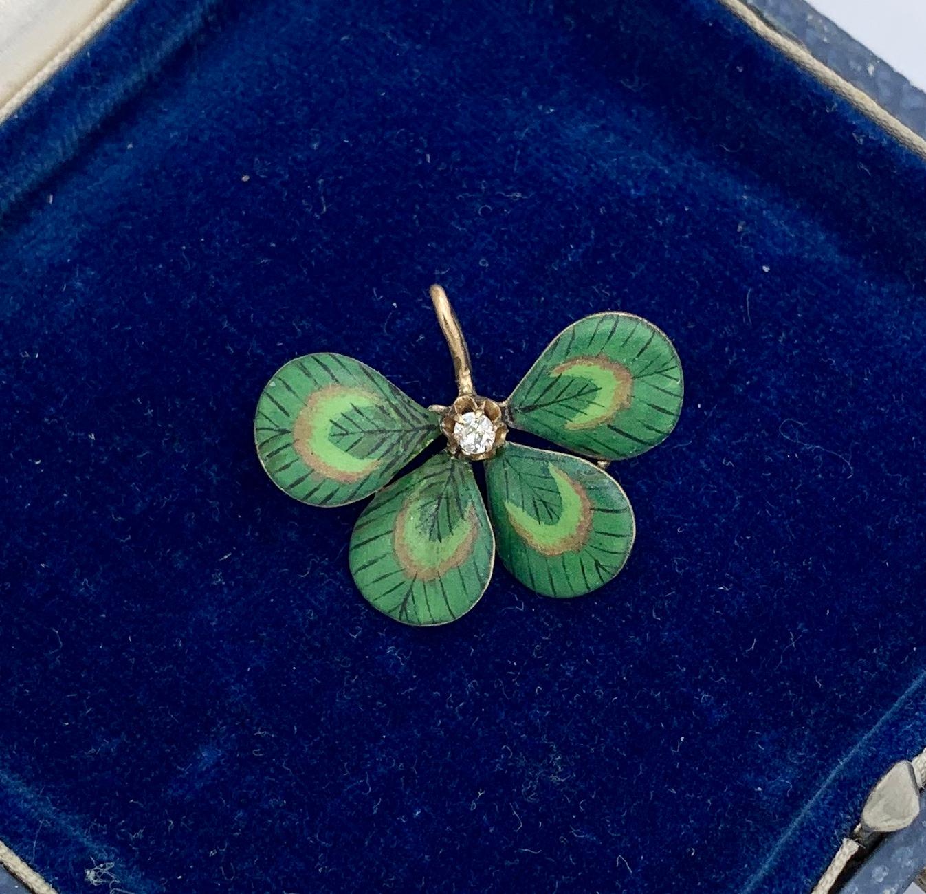 A very special Victorian - Edwardian Pendant in the form of a four leaf clover or shamrock in exquisite Enamel with an Old Mine Cut Diamond in the center.  The beautiful clover shamrock flower is done with exquisite enamel work in various shades of