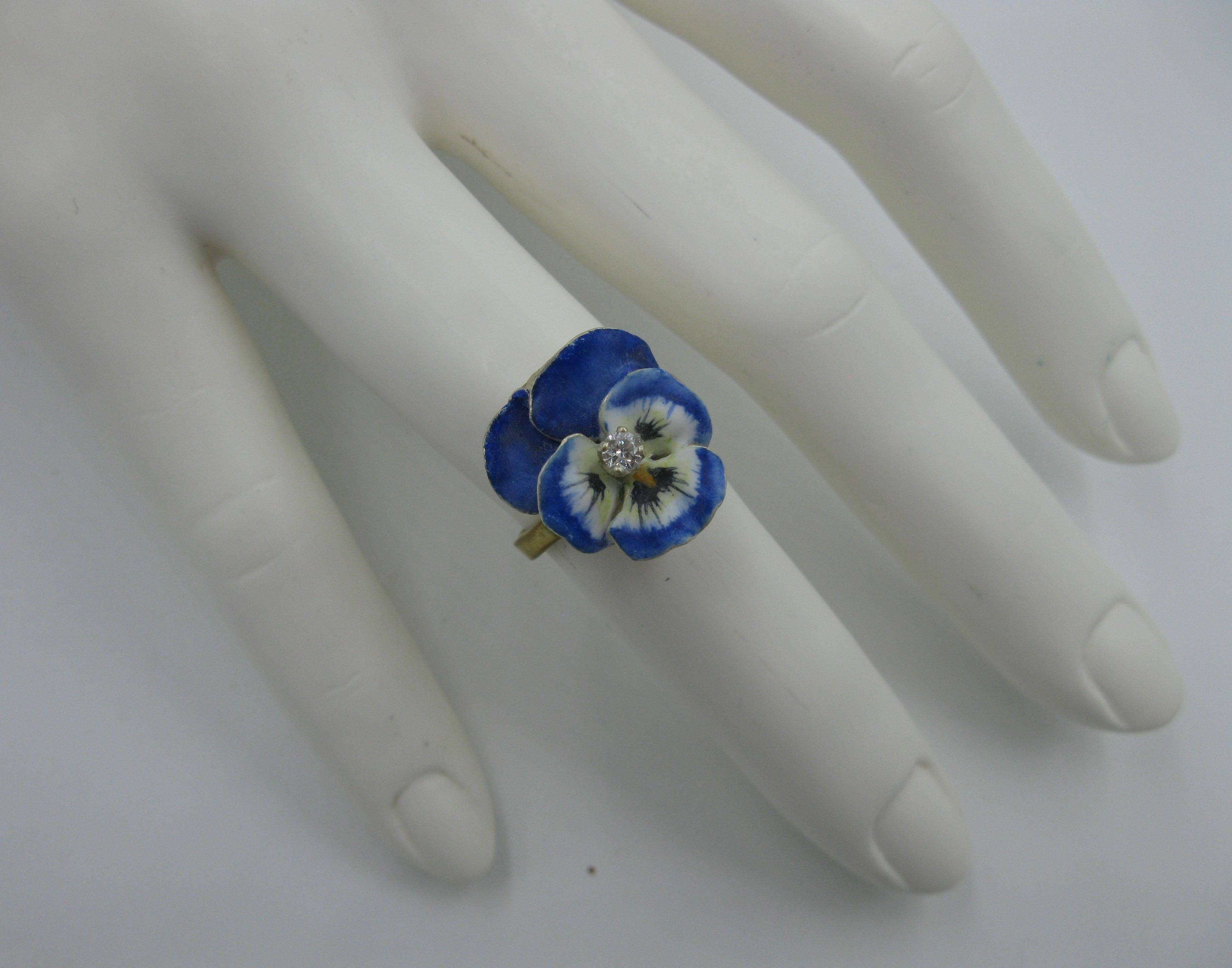 A very special Victorian - Edwardian Ring in the form of a Pansy Flower in gorgeous enamel with a central antique Diamond.  The beautiful flower is done with exquisite enamel work in various shades of blue with yellow and cream colored highlights. 