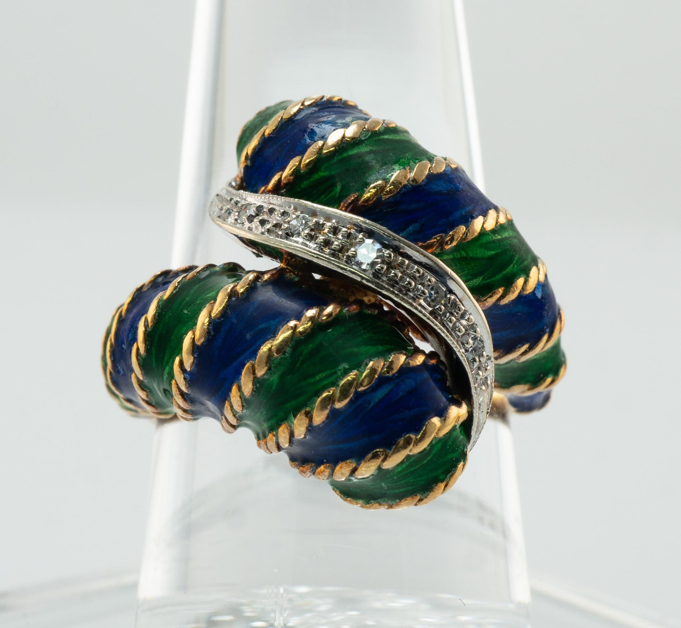 Diamond Enamel Ring 18K Gold Band Vintage Italy

This vintage ring is crafted in solid 18K gold.
Made in Italy.
Blue and green enamel is in great vintage condition.
Five single cut Diamonds are set in white gold.
The diamonds are VVS2 clarity and G