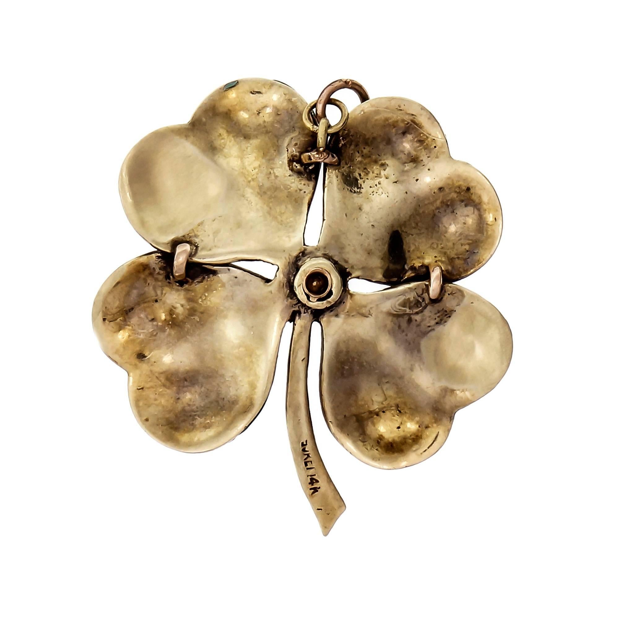 1940-1950 four leaf clover pendant hand enameled set with a brilliant cut Diamond. Made in 14k yellow gold.

1 round brilliant full cut Diamond, approx. total weight .23cts, H, VS2
14k yellow gold
Tested and stamped: 14k
19.9 grams
Top to bottom: