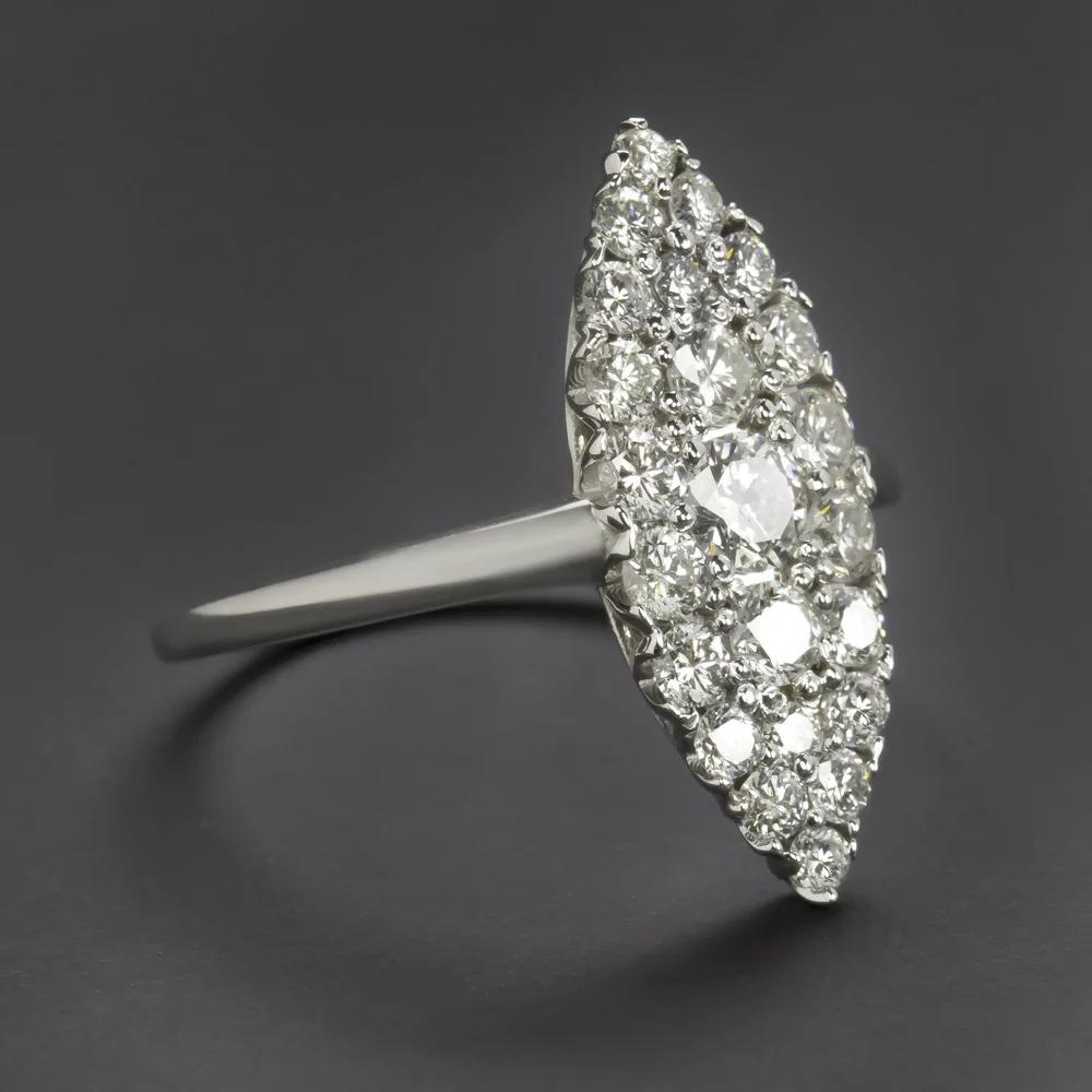 diamond encrusted cocktail ring is elegantly designed with an artful and elegant navette style. Measuring an eye catching 20.1mm across, this glamorous vintage style ring has an absolutely striking impact and delivers dazzling sparkle! The 14k white
