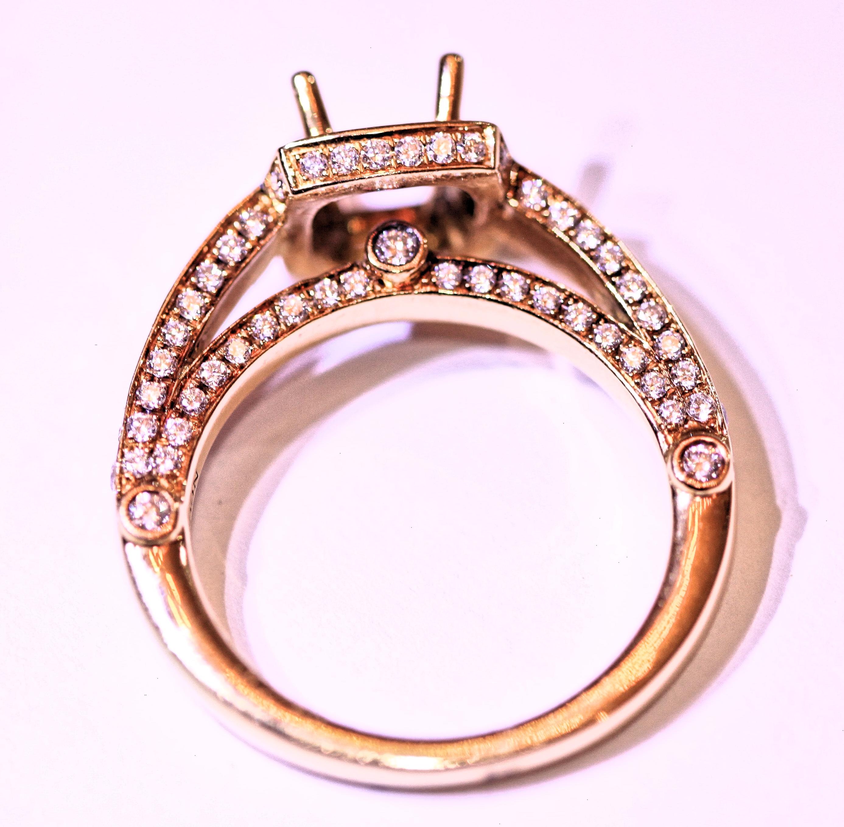 Ladies 18 karat yellow gold diamond engagement ring or right hand ring.  The ring has 1.14 carats
total weight of round brilliant cut diamonds.  The diamonds are white in color and VS-I in clarity.
The ring will hold a 6 1/2 mm center stone and the