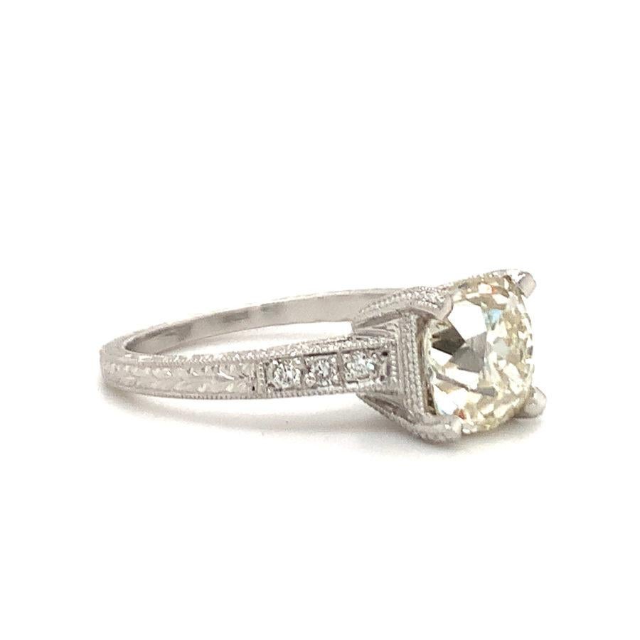 One antique style diamond engagement platinum ring featuring one prong set, old European cut diamond weighing 2.14 ct. Accented by six round brilliant cut diamonds weighing 0.10 ct. in total. Contemporary piece with vintage stone.

Alluring,